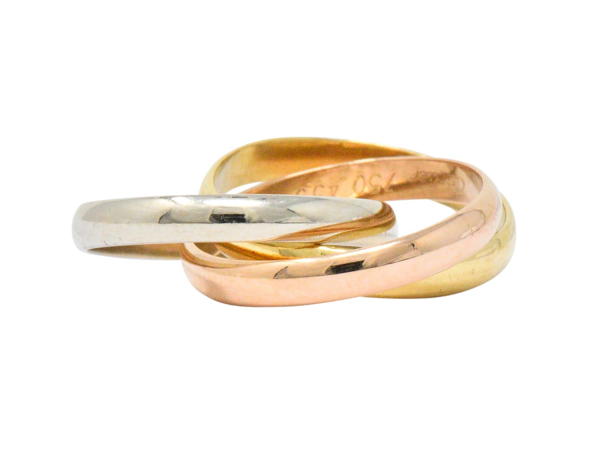 Featuring 3 interlocking half-round bands in 18 karat white, yellow and rose gold

From the famous and highly coveted 'Trinity' collection

Fully signed Cartier with maker's mark and stamped 