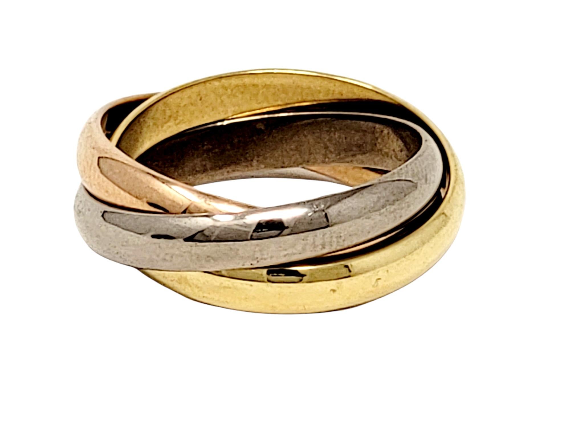 Popular Cartier Classic Trinity multi band tri-color ring set symbolizing love, fidelity and friendship. 

Ring type: Band
Metal: 18K Yellow, White and Rose Gold
Weight: 9.3 grams
Size: 56
U.S. Ring Size: 7.5
Individual band width: 3.53 mm
Stamped: