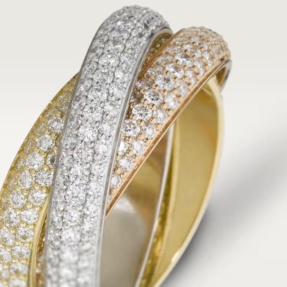 Trinity ring, medium model, 18K white gold (750/1000), 18K rose gold (750/1000), 18K yellow gold (750/1000), set with 432 brilliant-cut diamonds totaling 2.98 carats (approx.)

Size 50 (EU). 

Excellent condition. 

Service receipt from Cartier