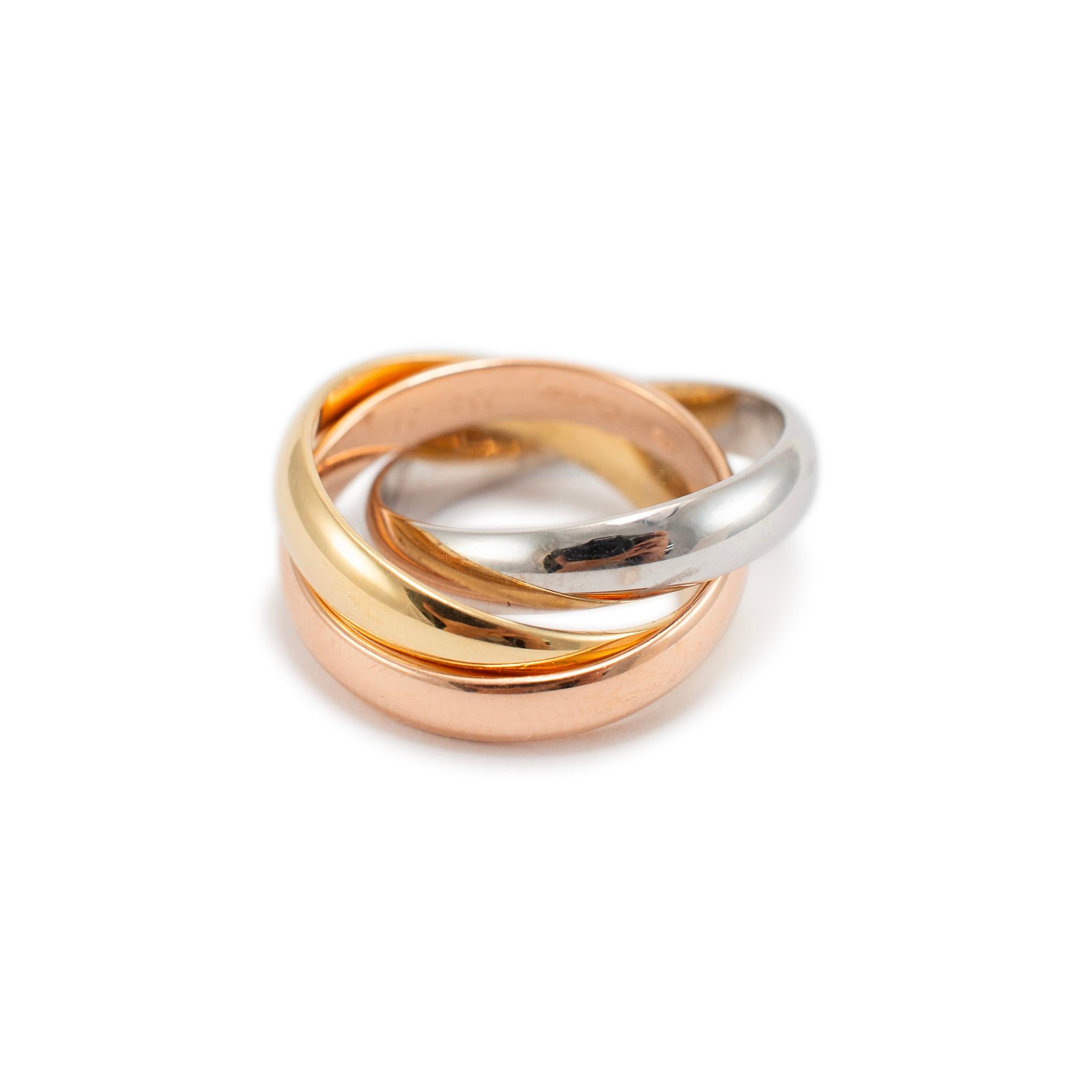 Brand: Cartier

Gender: Unisex

Metal Type: 18K Yellow & 18K White Gold & 18K Rose Gold

Ring Size: 6

Width: 10.00 mm

Weight: 10.85 grams

18K tri-color gold interlocking wedding band with a comfort-fit shank. The metal was tested and determined