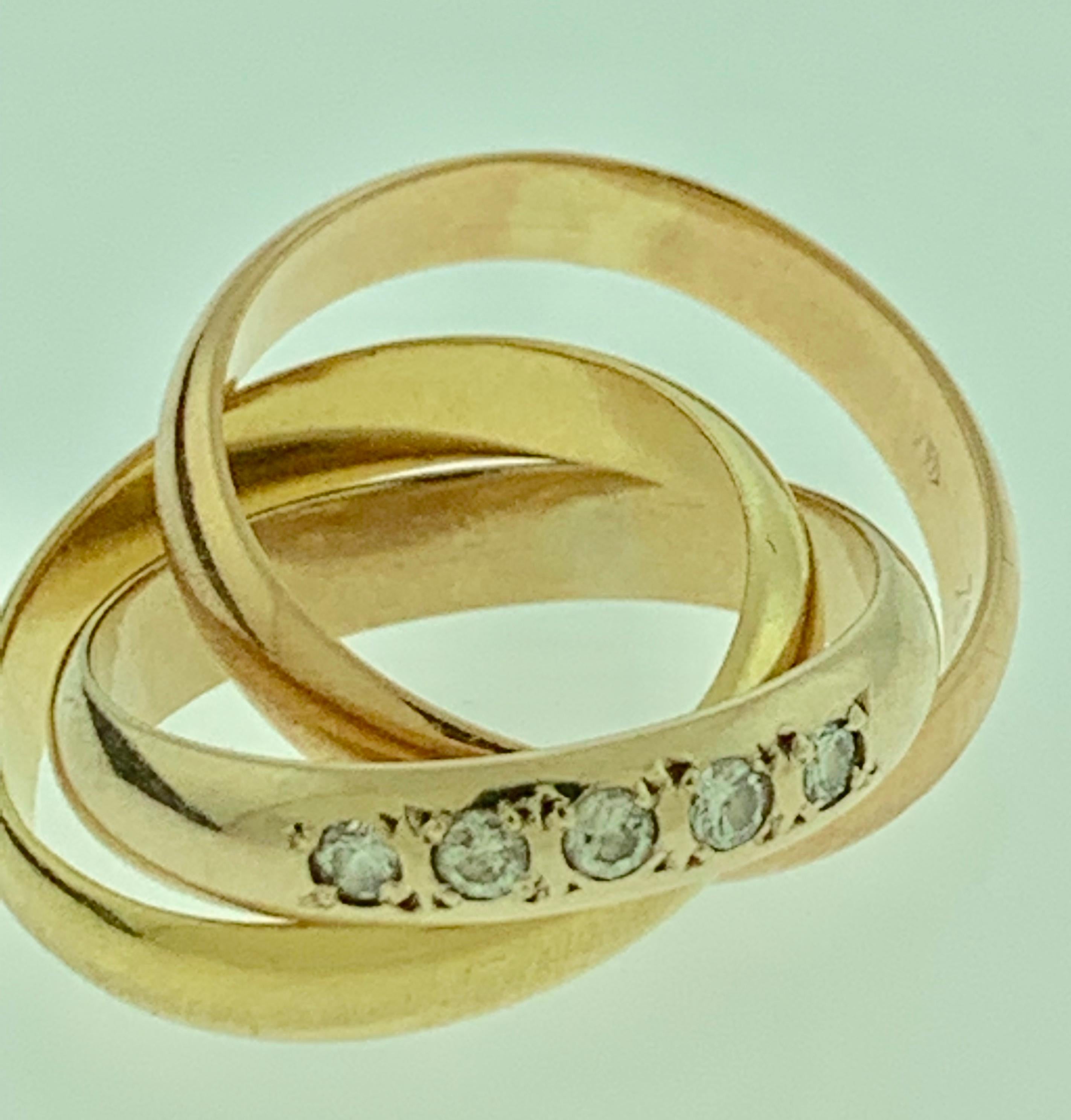 Cartier Tri Color Gold And  5 Diamond Ring 18 Karat Yellow Gold, Size 5 1/2
One of the ring has 5 round diamonds.
Color of the rings are not very distinctly different from each other.
one yellow , one Rose and one White
Metal:	18k Tri-Color