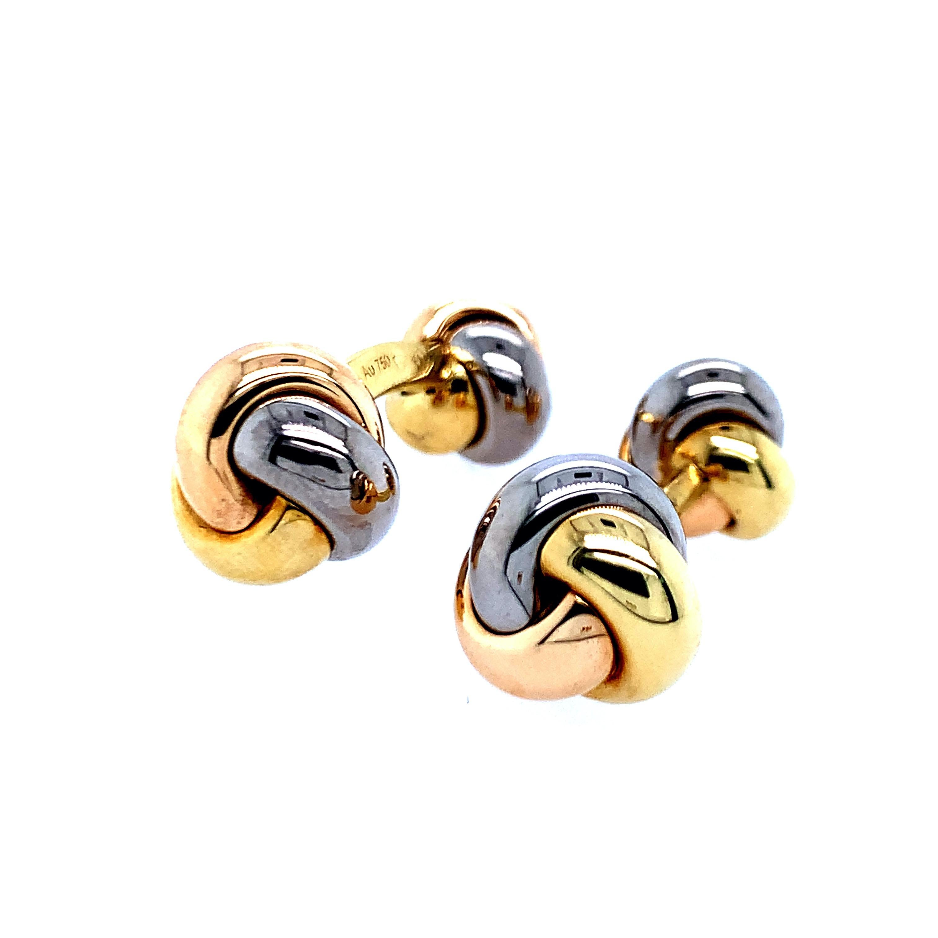 Created by Cartier, these set of cufflinks consists of three different kinds of 18 karat gold: yellow, white, and rose. They are knotted together on both ends of the cufflinks. Total weight: 11.7 grams. Length: 2.9 cm. Made in France.

Serial No.