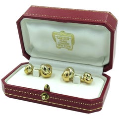 Cartier Manschettenknöpfe mit Unendlichkeitsknoten aus dreifarbigem Gold