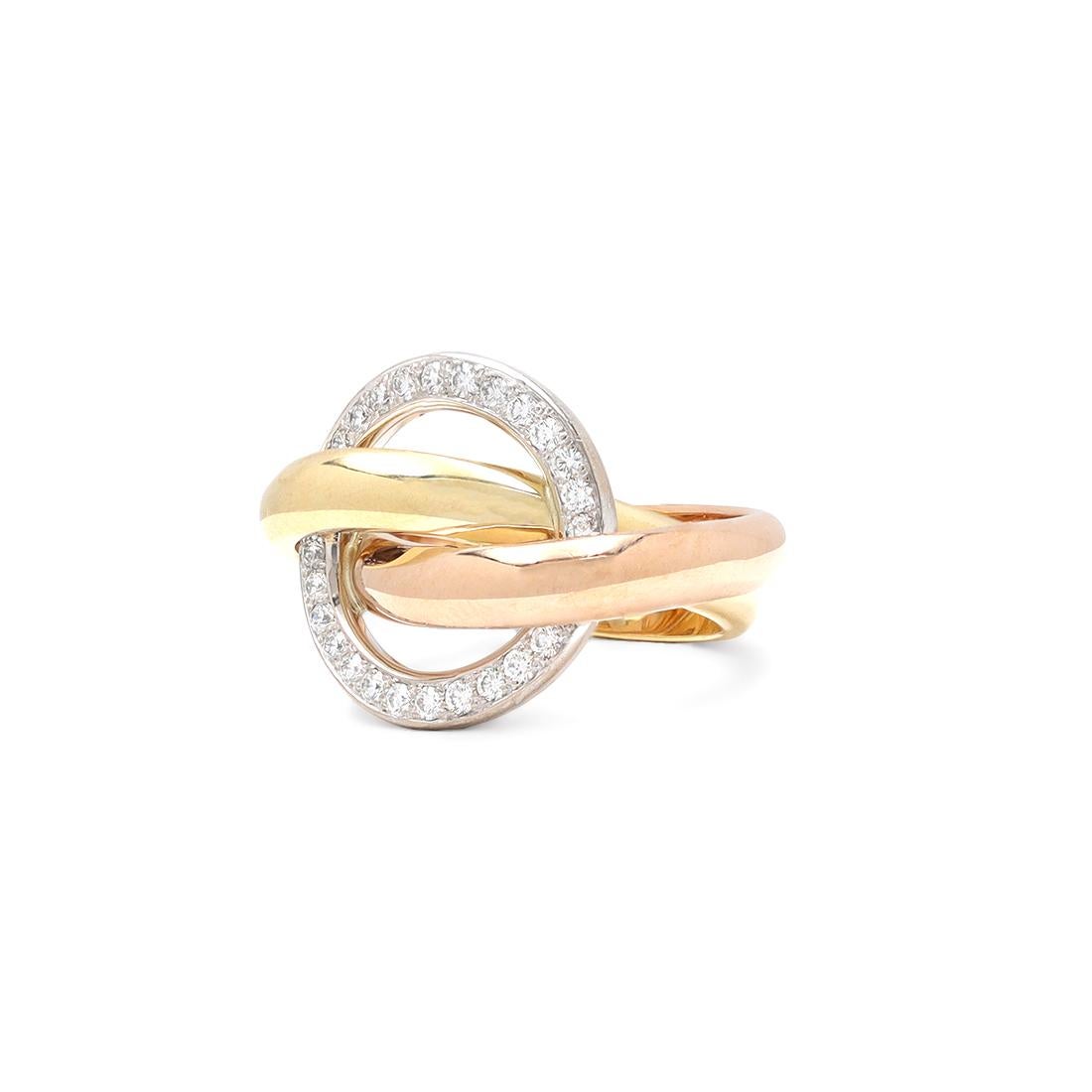 Authentic Cartier Trinity 'Crash' ring comprised of interlocking tri-color 18 karat gold bands. The fixed white gold band is set with round brilliant cut diamonds estimated 0.48 carats total weight. Signed Cartier, 53, 750, with serial number and