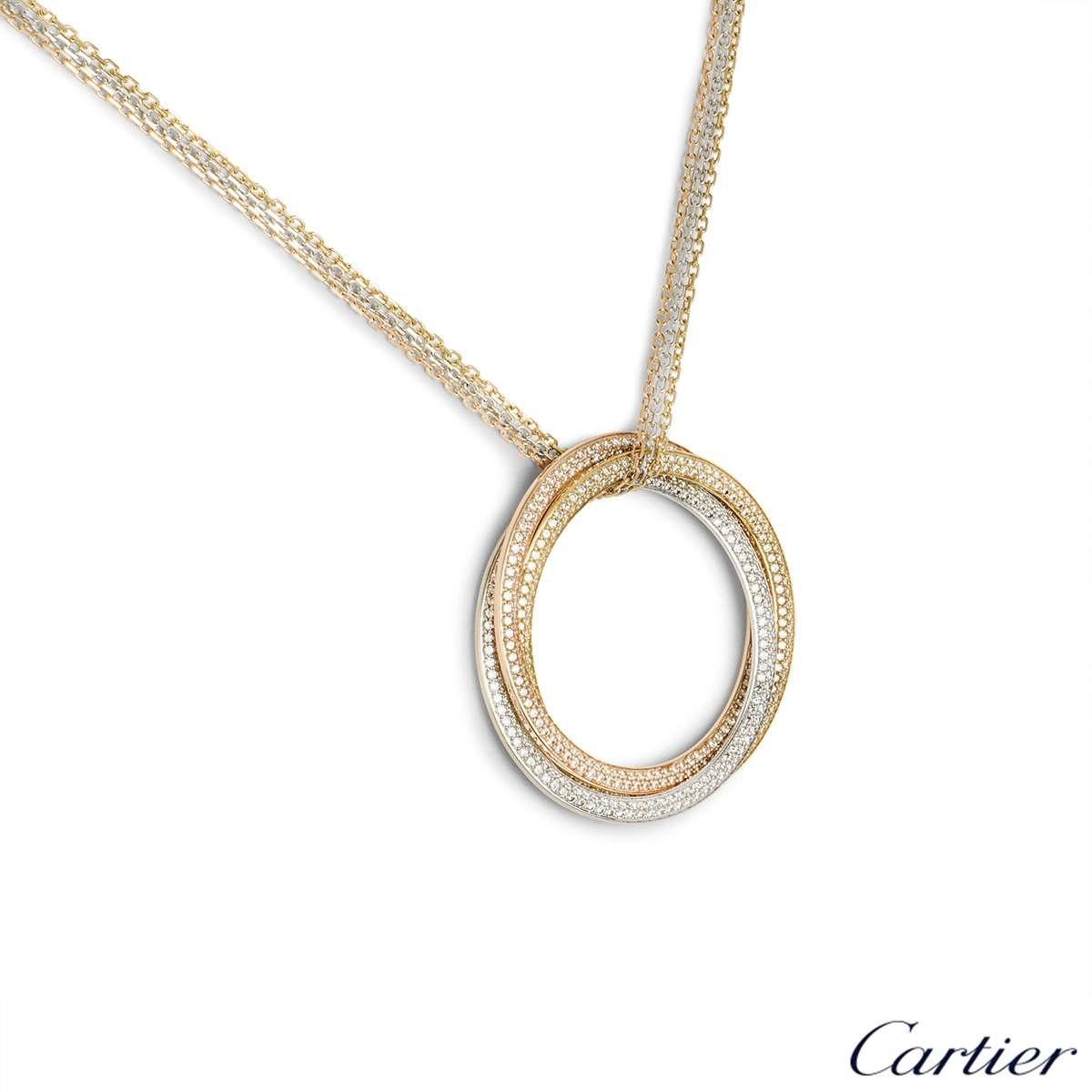 An alluring 18k tri-colour gold diamond large necklace by Cartier from the Trinity De Cartier collection. The necklace is composed of three open work circular motifs entwining in yellow, white and rose gold set with pave round brilliant cut diamonds
