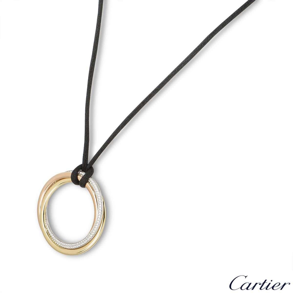 A stylish 18k tri-colour gold and diamond necklace from the Trinity de Cartier collection. The pendant features triple interlaced rings in rose, yellow and white gold, the white gold ring has approximately 180 round brilliant cut diamonds totalling