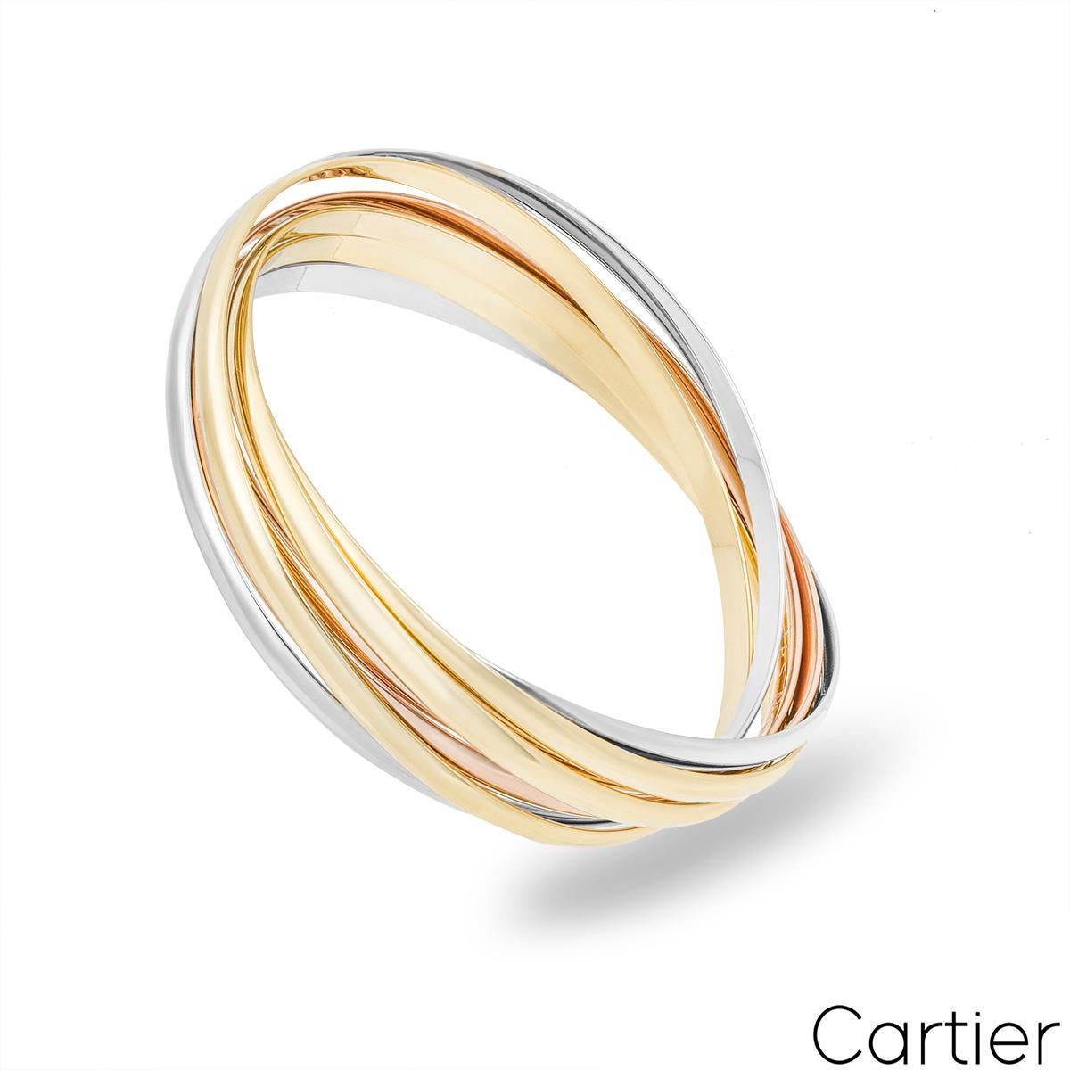 An iconic 18k tri-colour Cartier bracelet from the Trinity De Cartier collection. The bracelet is made up of seven intertwined 18k white, rose and yellow gold 3.5mm bands. The bracelet fits a wrist size of up to 18.5cm and has a gross weight of