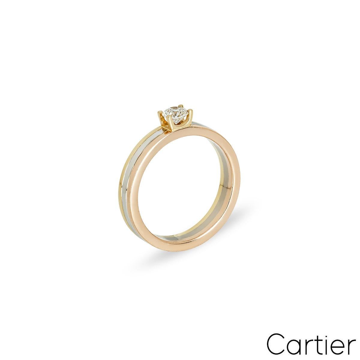 A gorgeous 18k tri-colour gold diamond ring by Cartier from the Trinity de Cartier collection. The ring is set to the centre with a 0.24ct round brilliant cut diamond. The diamond is set within a classic 4 prong setting with the band itself