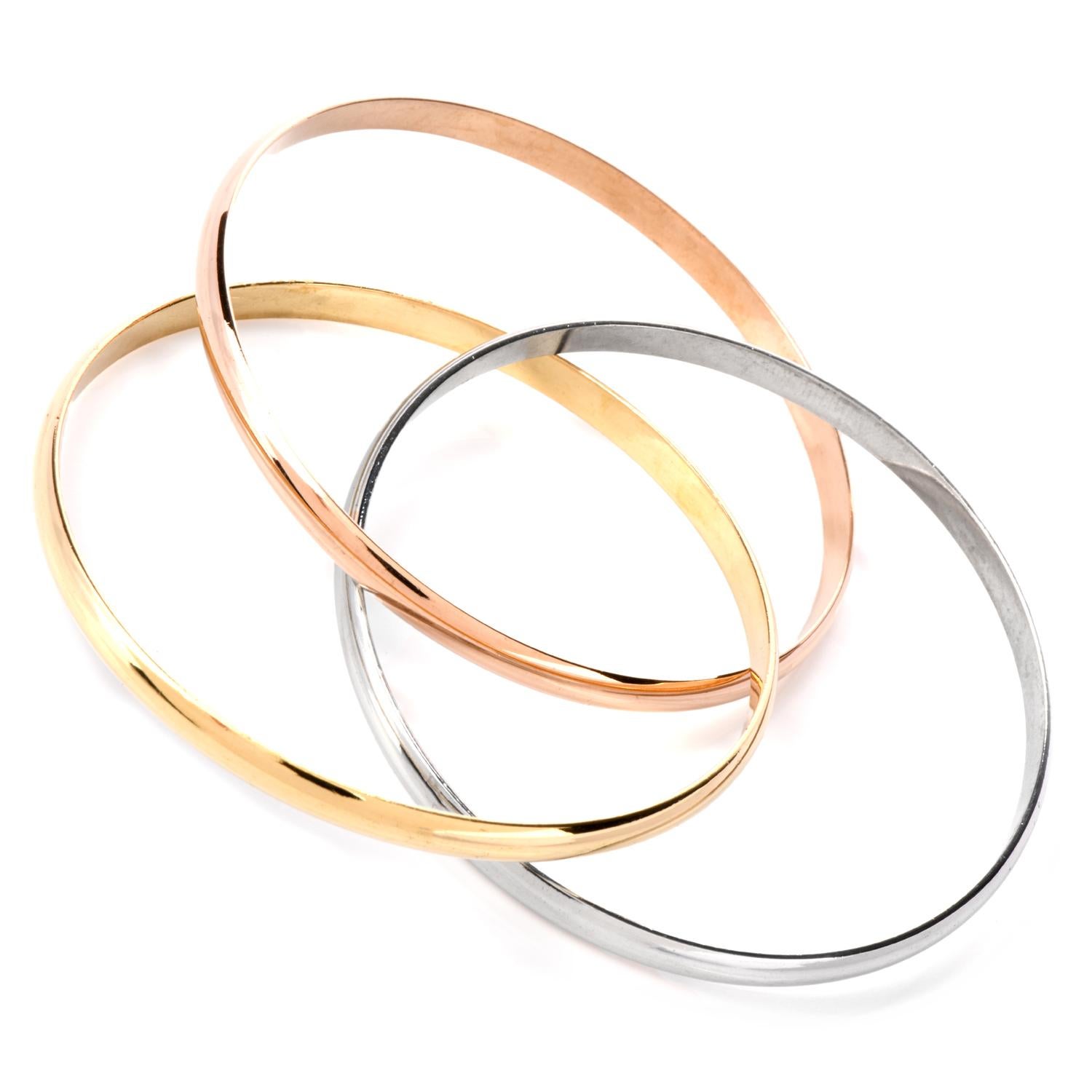 Mix and Match your entire jewelry wardrobe while

wearing and enjoying this beatiful Catier multi-bangle bracelet

cast in 18K rose, yellow and white gold.

Each interlocking bracelet has been high polished to accent

the color.

Weighing appx. 60.1
