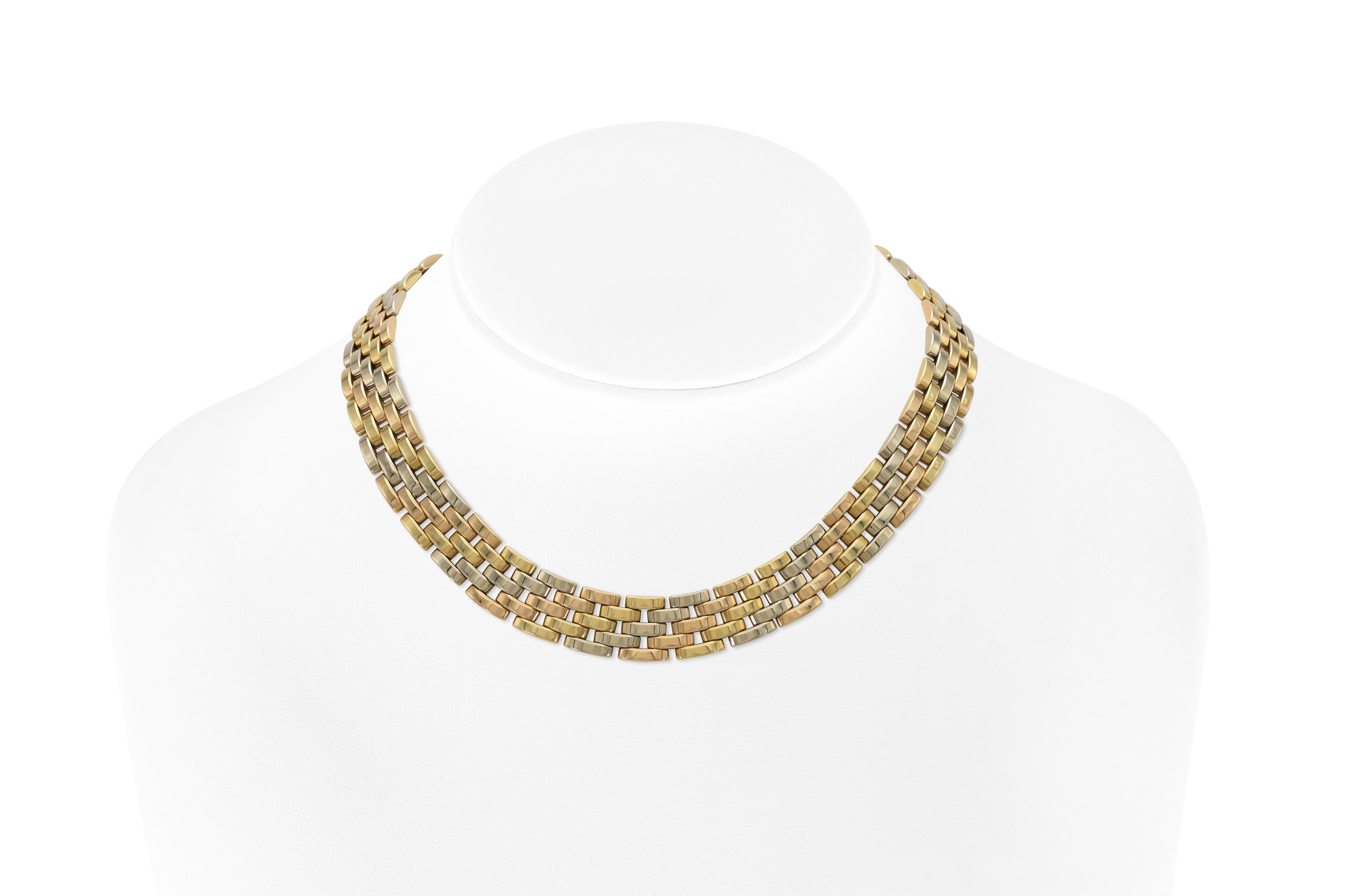 Finemente realizzato in oro giallo, bianco e rosa 18 carati.
Firmato da Cartier, dalla sua Collectional Panthere
15 1/2 x 1 /2 pollici