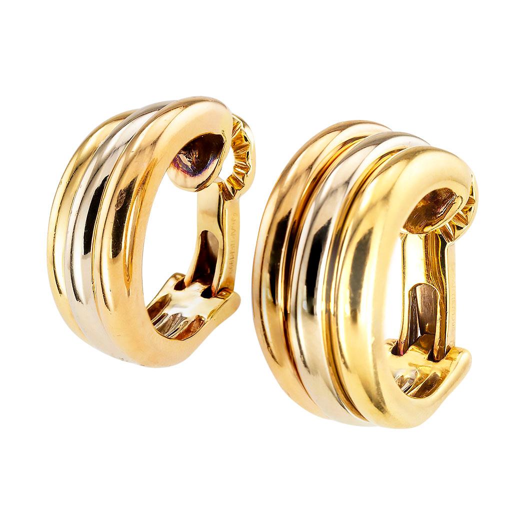Cartier tricolor gold half hoop clip earrings circa 1995.  Clear and concise information you want to know is listed below.  Contact us right away if you have additional questions.  We are here to connect you with beautiful and affordable jewelry. 