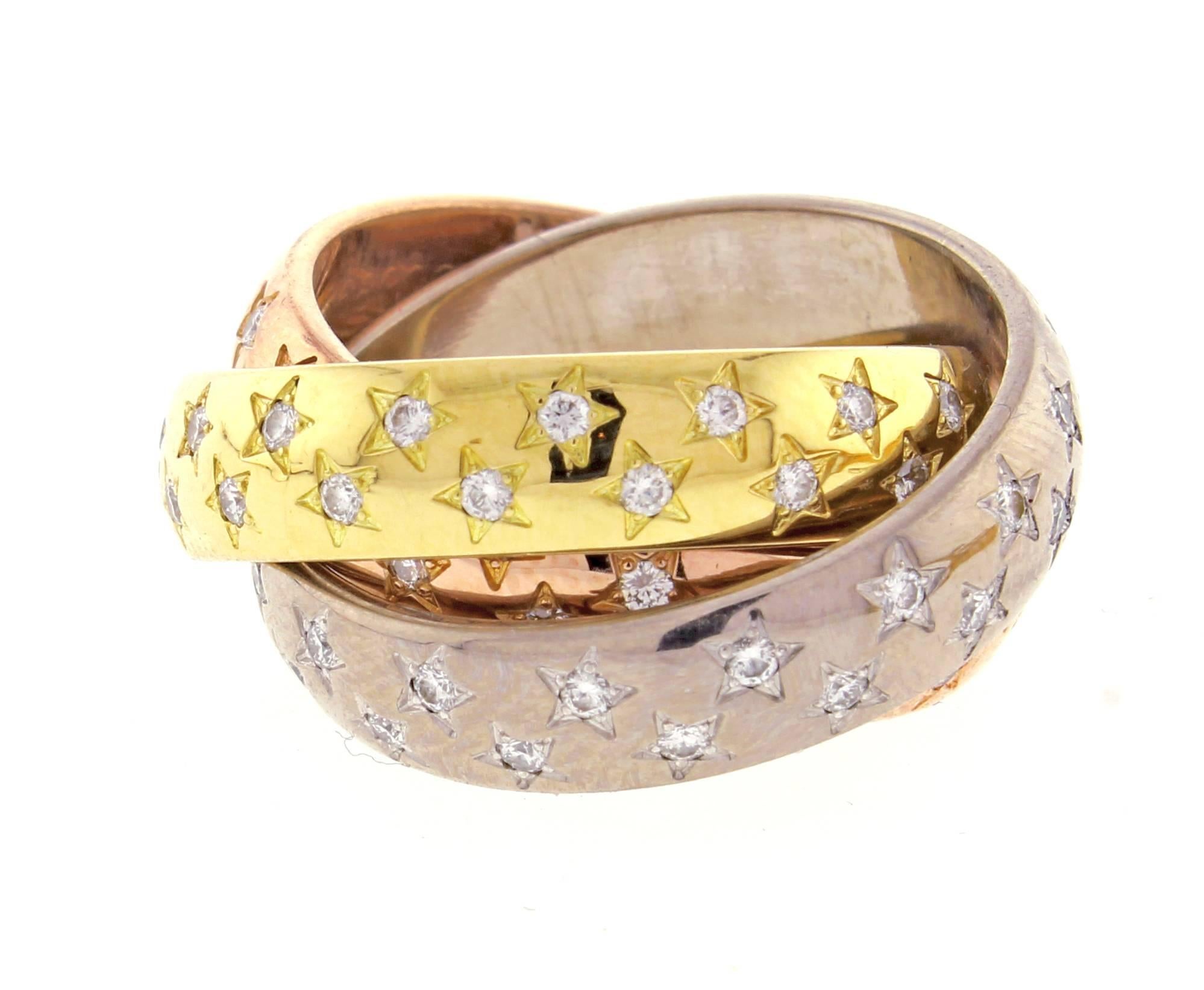 Inspired by the original Trinity ring from 1924 , Cartier's Trinity 100 collection are set with 100 diamond stars for  each year Cartier has been in the US.  5.5mm bands size 53  US 6 ½  100 diamonds weigh approximately 1 carat.  18 karat