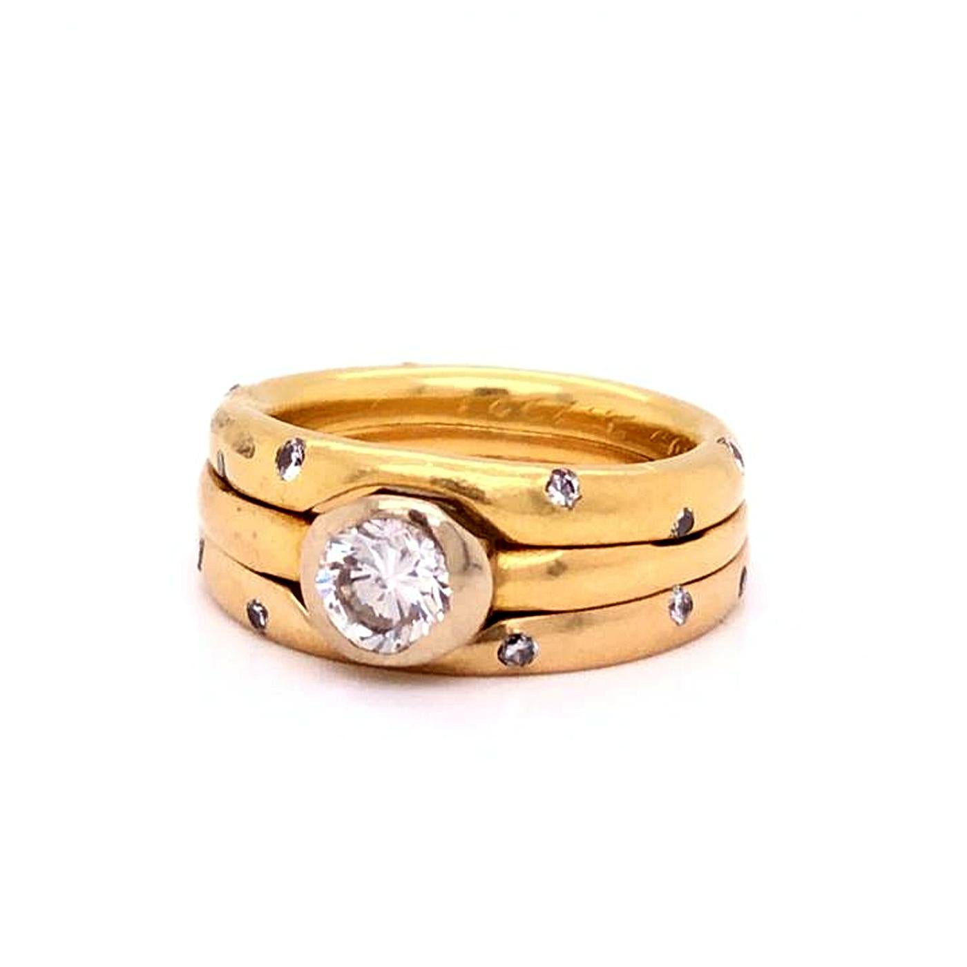 Trinity ring, 18 karats yellow Gold, Center stone approx 0.80ct G/H color VS1 - Clarity With additional 22 Round diamonds 0.35 Carat total Size 6.5

Specification:
Metal Purity: 18k
Sizable: No
Style: Band / Ring
Style: Rolling
Metal: Yellow