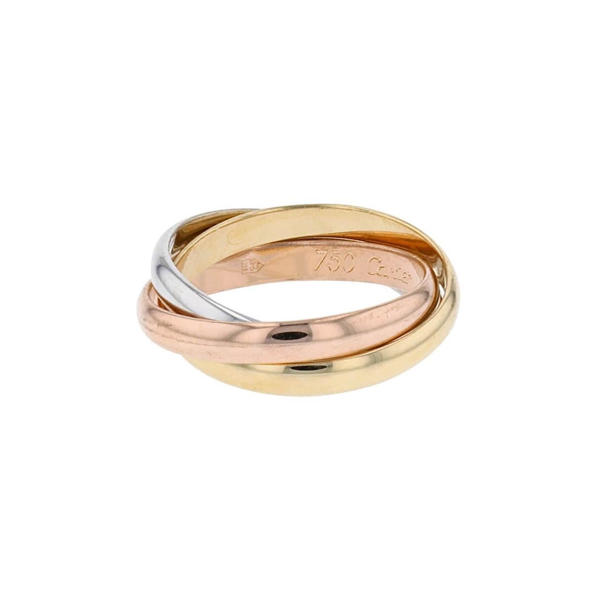 Elegant Trinity ring, small model with 3 interlaced mobile rings, 18 carat white gold, 18 carat pink gold, 18 carat yellow gold.

Small model

The 3 golds are 18 Karats, 750/1000ths.

Signed Cartier on the inside and numbered

Finger size : 51
It