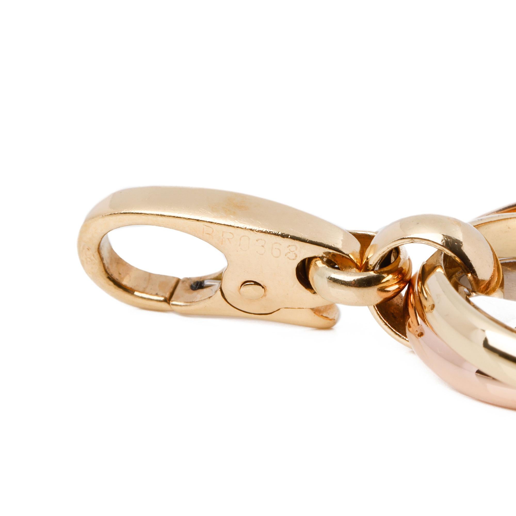 This charm by Cartier is from their Trinity range and features 3 interlinking ring in 18ct yellow, white and rose gold. It can be worn as a charm on a bracelet or as a pendant on a chain and is accompanied by a Cartier box and certificate. Our Xupes