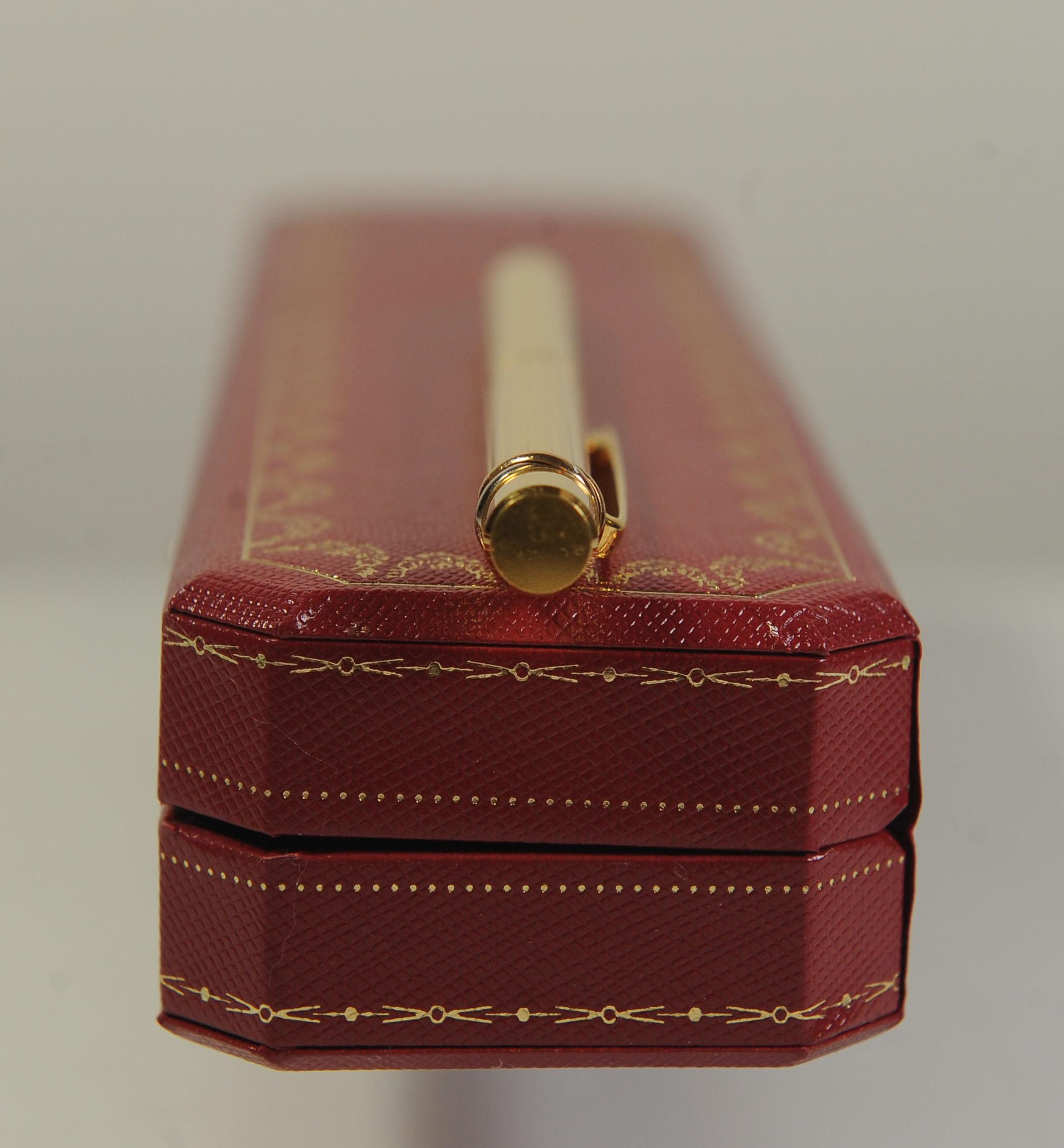 Cartier Trinity 18ct Gold Plated Ribbed Ballpoint Pen With A Red Cartier Box For Sale 4