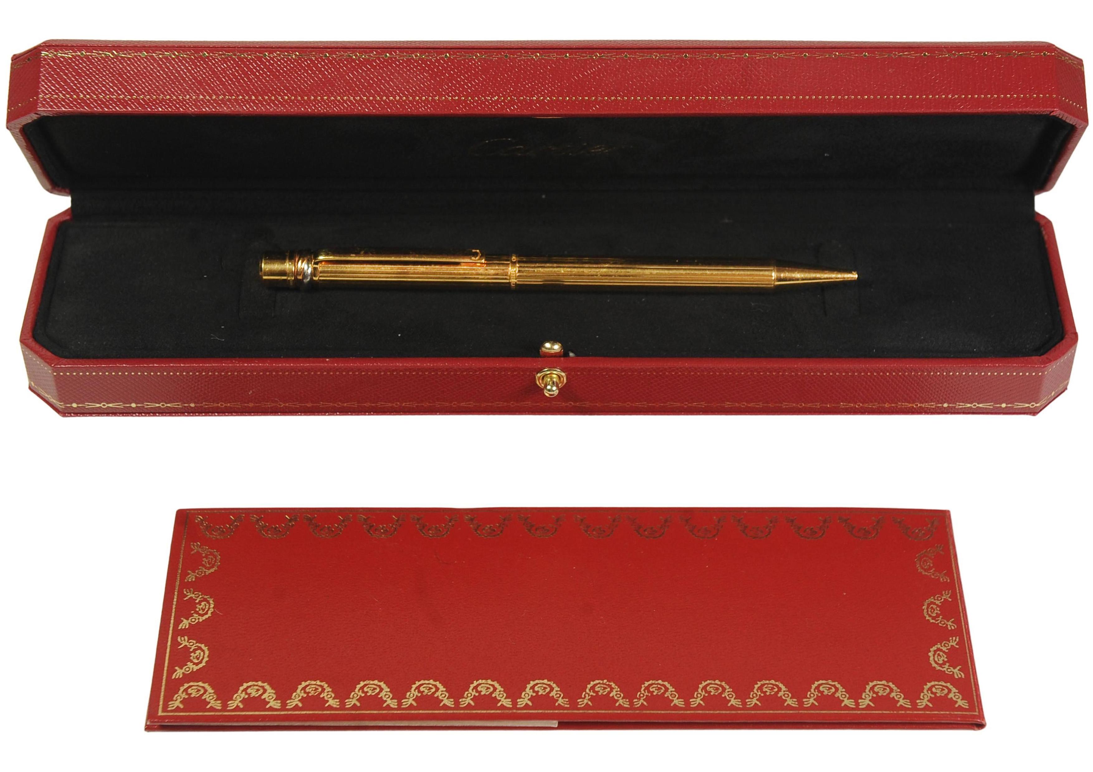Cartier Trinity 18ct Gold Plated Ribbed Ballpoint Pen With A Red Cartier Box

Stunning Example of a Must De Cartier ballpoint pen, featuring the classic trinity rings and an enamel ident to the clip pen.

Cartier pens are designed by Cartier, & are