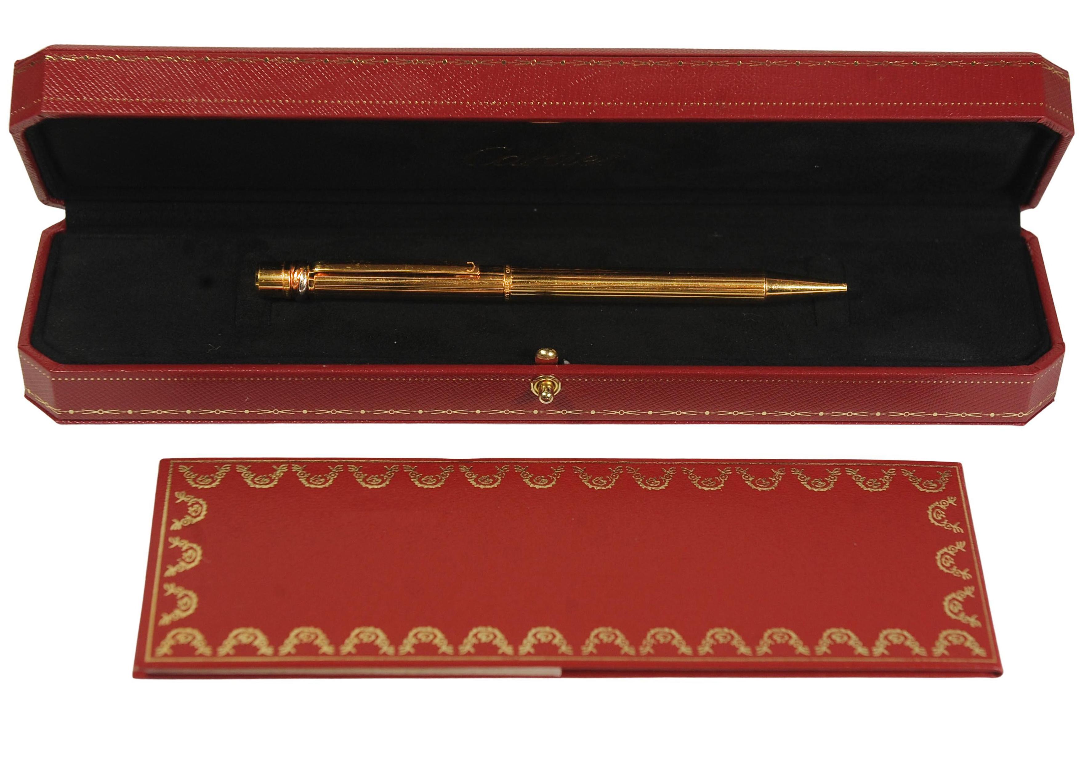 20th Century Cartier Trinity 18ct Gold Plated Ribbed Ballpoint Pen With A Red Cartier Box For Sale