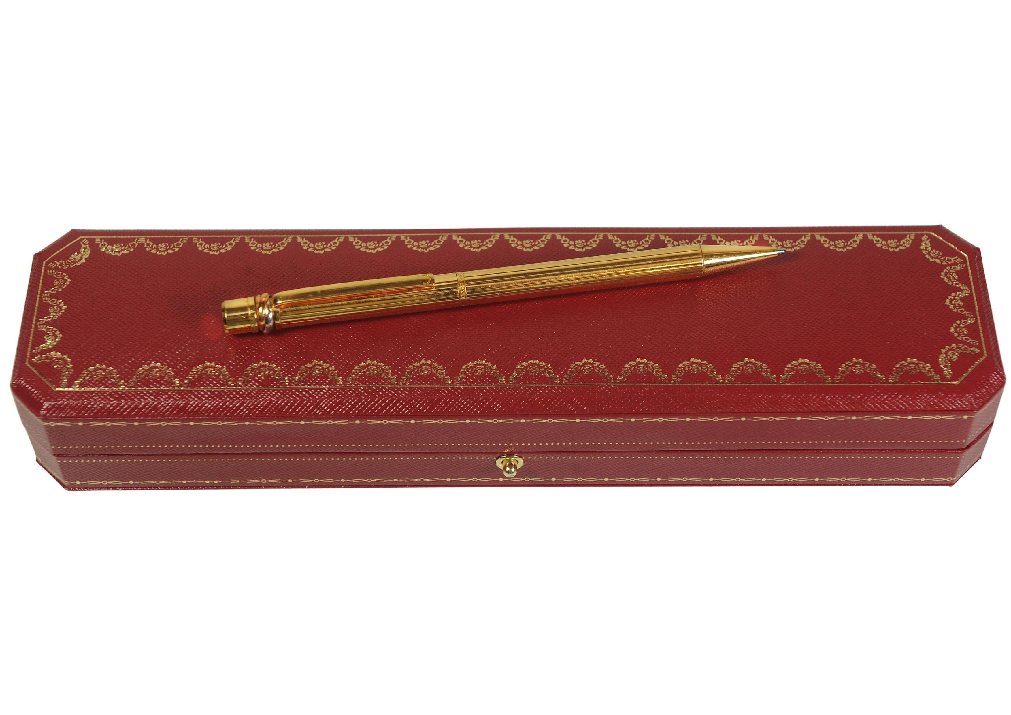 Cartier Trinity 18ct Gold Plated Ribbed Ballpoint Pen With A Red Cartier Box For Sale 2