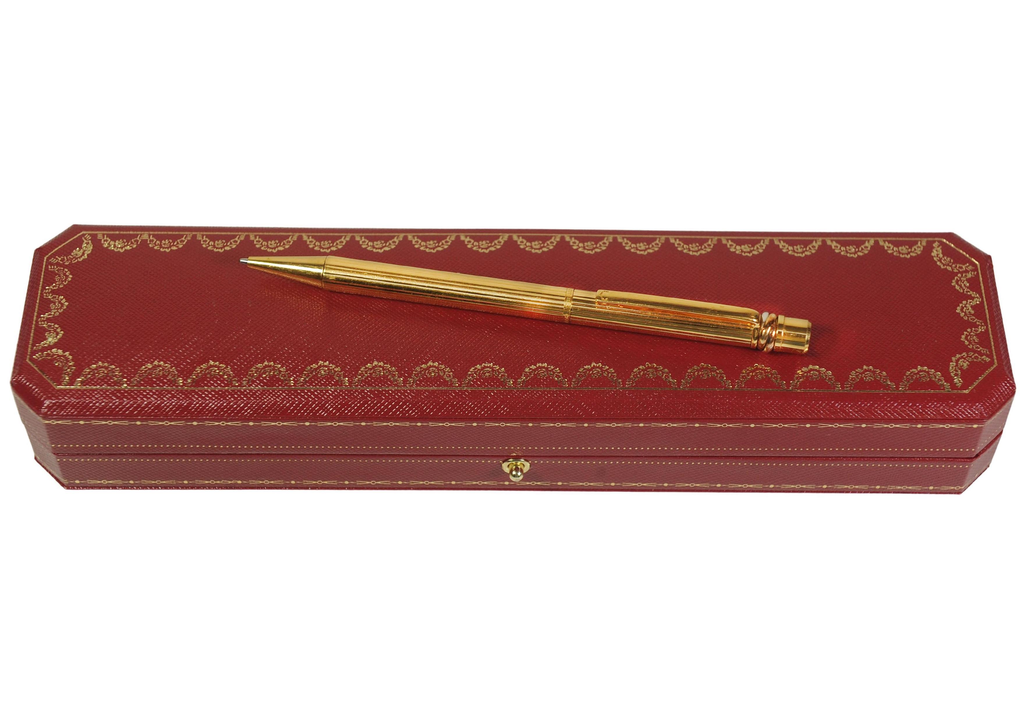 Cartier Trinity 18ct Gold Plated Ribbed Ballpoint Pen With A Red Cartier Box For Sale 3