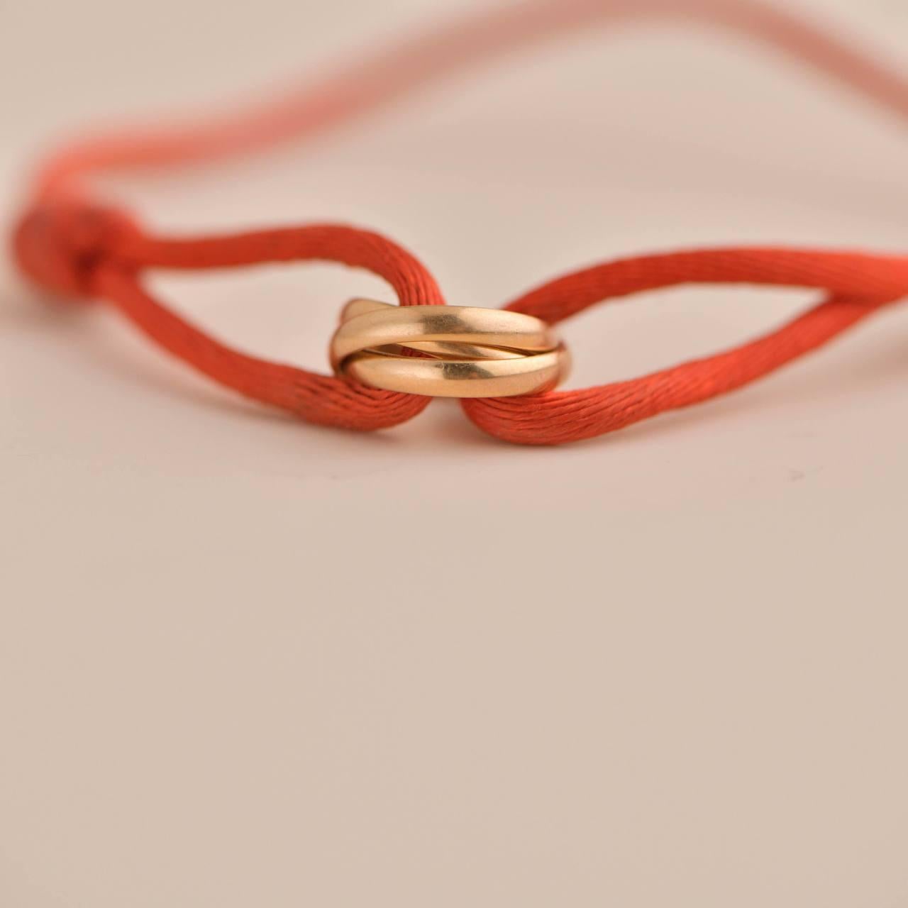 trinity bracelet cartier red