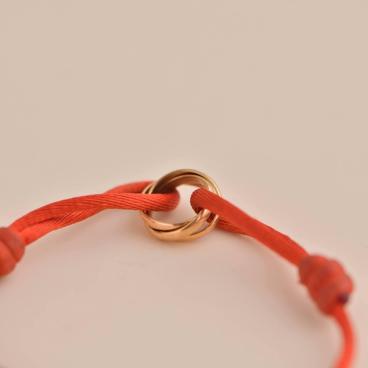 Cartier Trinity 18K Rose Gold Orange Cord Bracelet In Excellent Condition In Banbury, GB