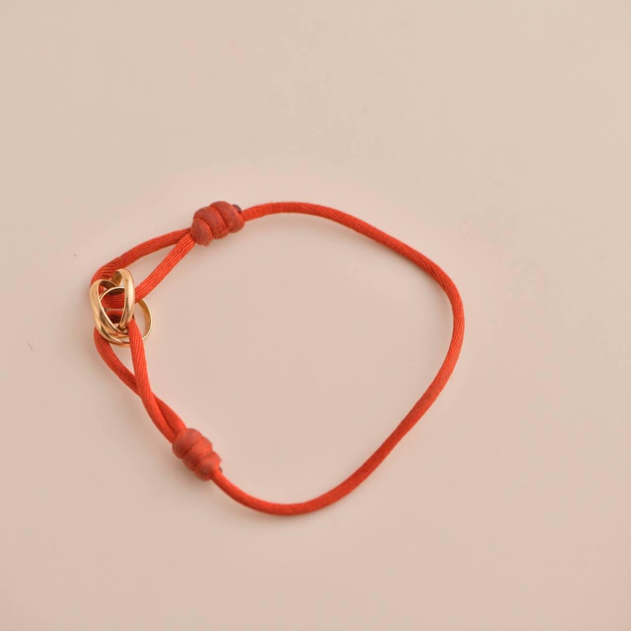 Women's or Men's Cartier Trinity 18K Rose Gold Orange Cord Bracelet