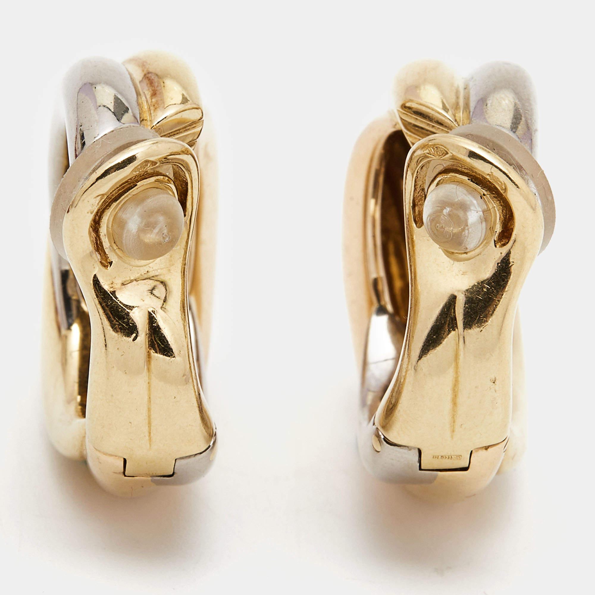 Crafted from lustrous 18k gold, these Cartier Trinity earrings exude timeless elegance. Their distinctive three-tone design, blending yellow, rose, and white gold, symbolizes unity and harmony. With meticulous attention to detail, they radiate