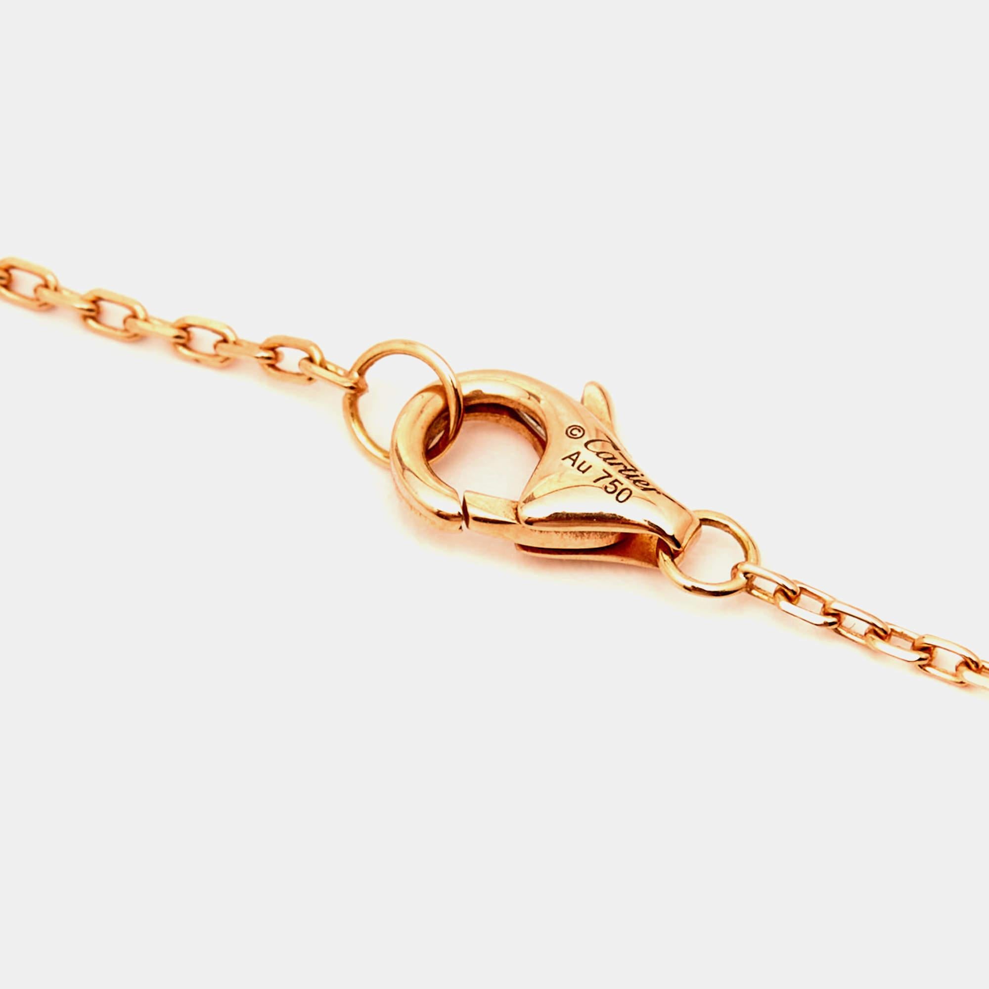 The Cartier necklace is a luxurious piece of jewelry featuring three intertwined rings made of 18k white, yellow, and rose gold. This iconic design symbolizes love, fidelity, and friendship, creating an elegant and timeless