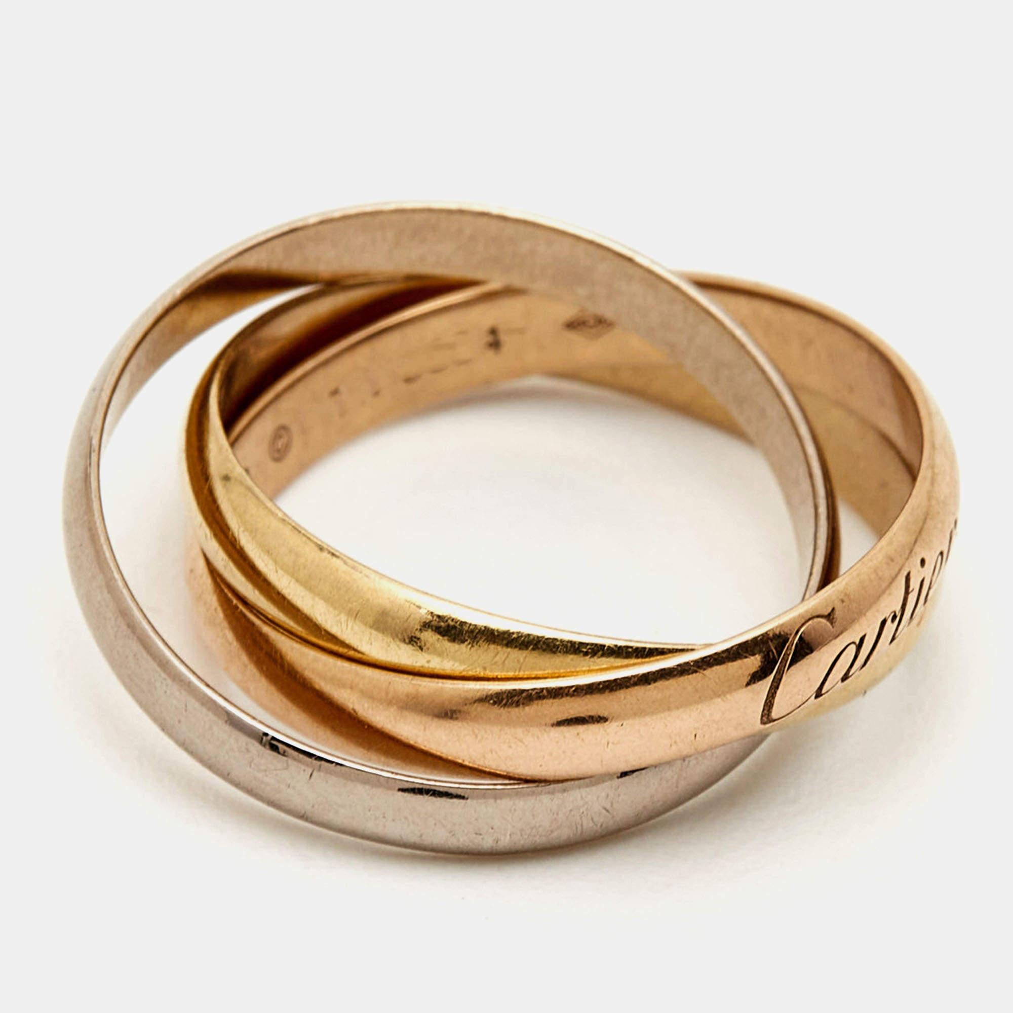 The Cartier Trinity ring is a luxurious and iconic piece of jewelry. Crafted from 18k white, yellow, and rose gold, the ring features interlocking bands symbolizing love, fidelity, and friendship. Its small size adds a touch of elegance, making it a