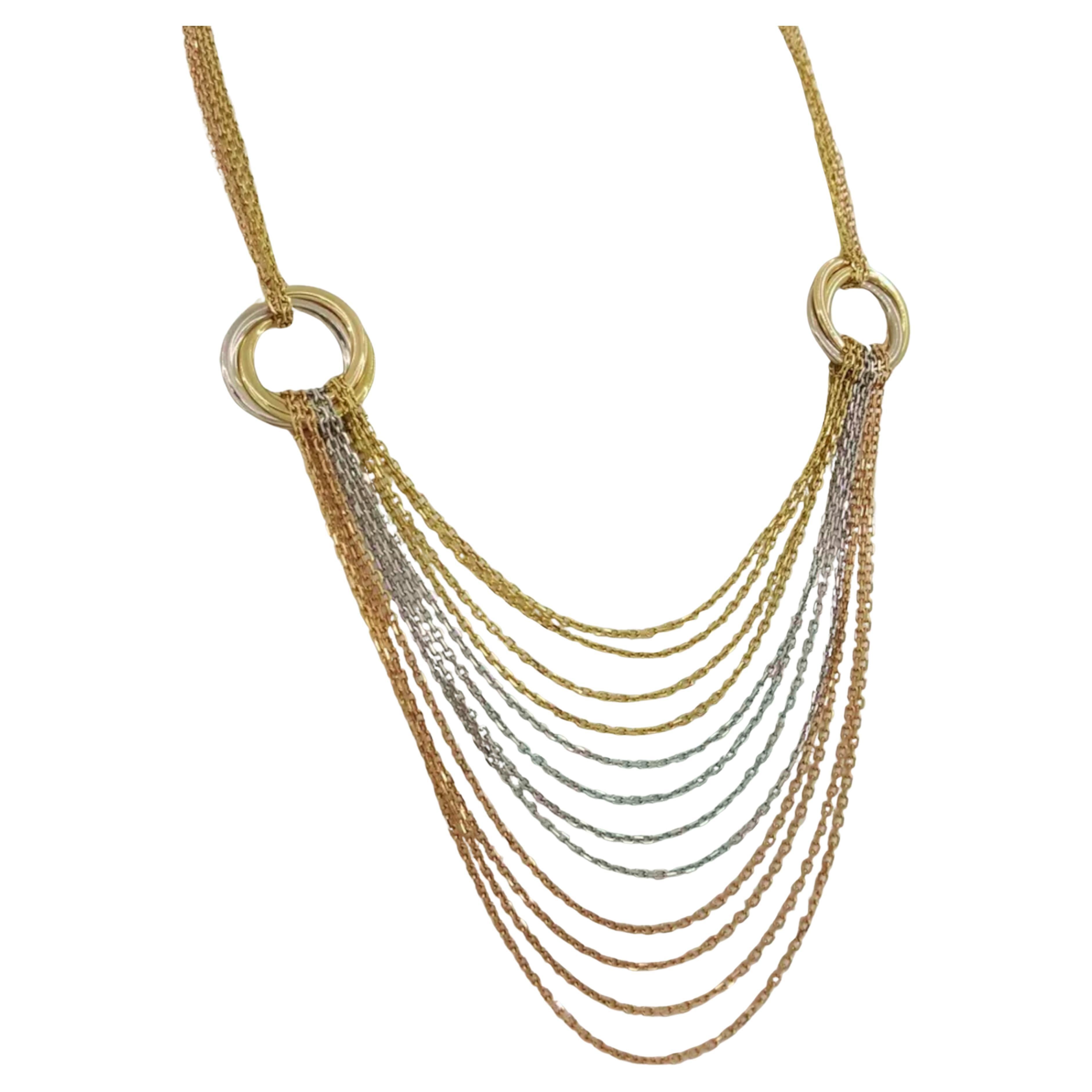  Le collier à chaîne drapée en or tricolore 18K de Cartier Trinity est une pièce magnifiquement réalisée avec de l'or jaune, de l'or blanc et de l'or rose. Il pèse 34,6 grammes et mesure 16 pouces pour la partie supérieure, s'étendant jusqu'à 22