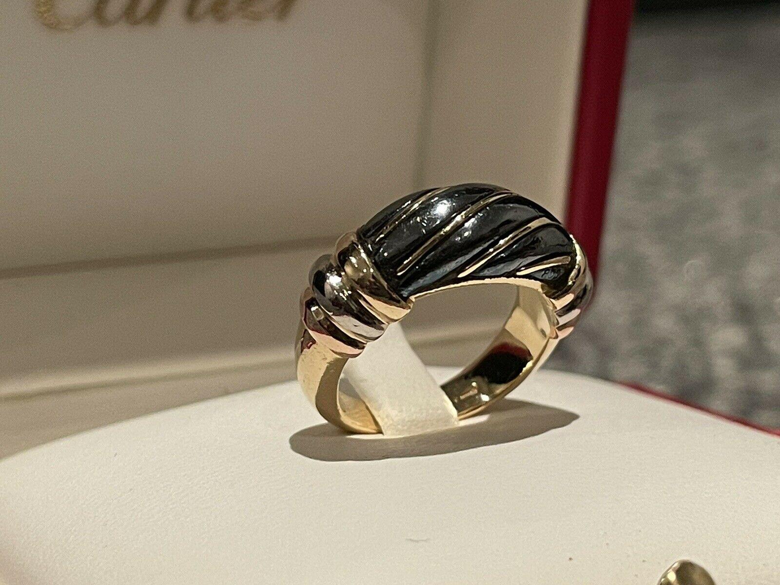 Cartier Trinity 18k Tri Color Gold & Hematite Ring Vintage

Here is your chance to purchase a beautiful and highly collectible designer ring.  Truly a great piece at a great price! 

The weight is 6.8 grams and is a size 3.5.  This ring is fully