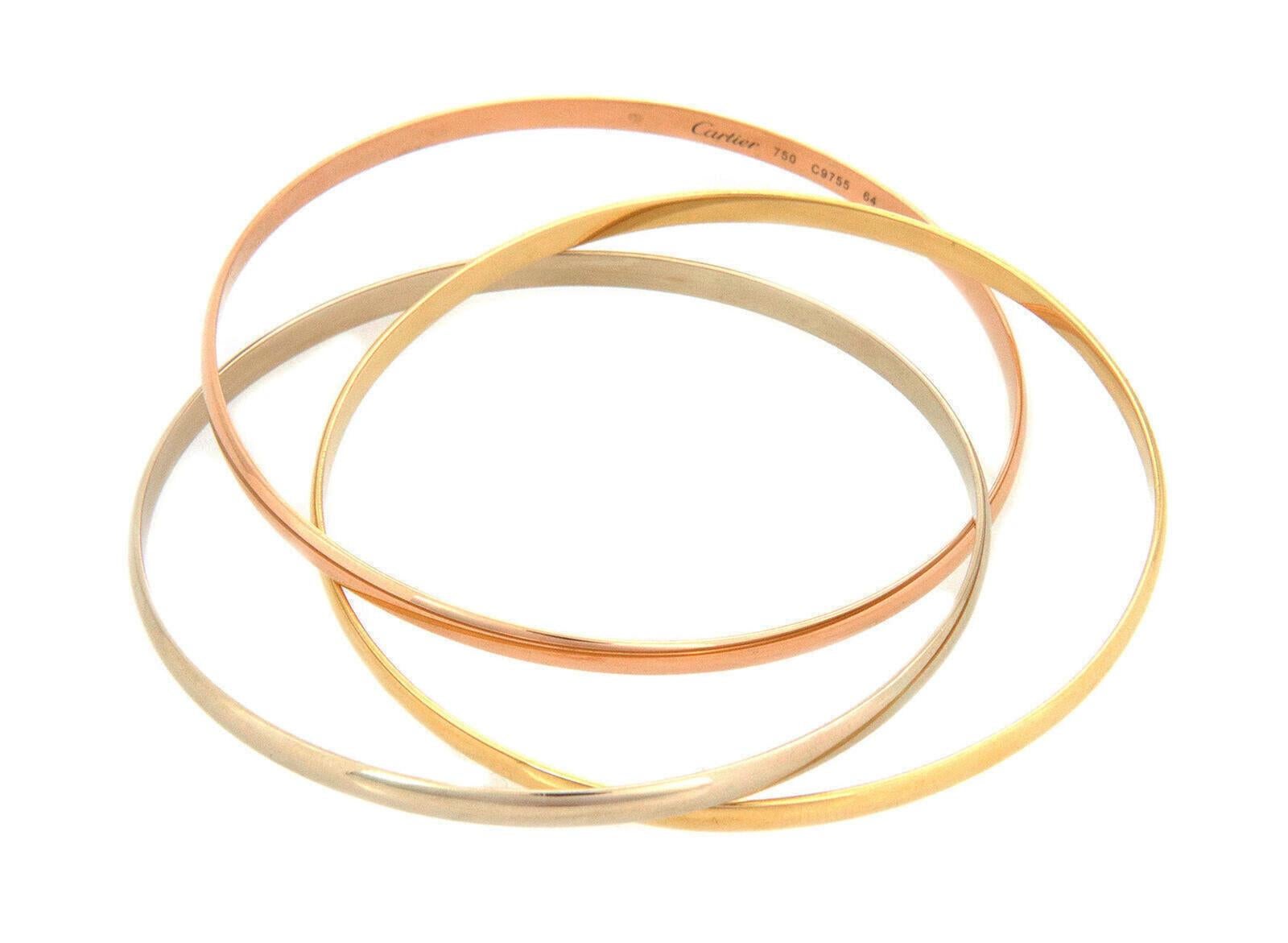 These gorgeous authentic triple interlaced bangles are by Cartier from the Trinity Collection. They are crafted from 18k pink, white and yellow gold respectively in a fine polished finish.  Each bangle is 3.5mm wide with a dome shape. They are set