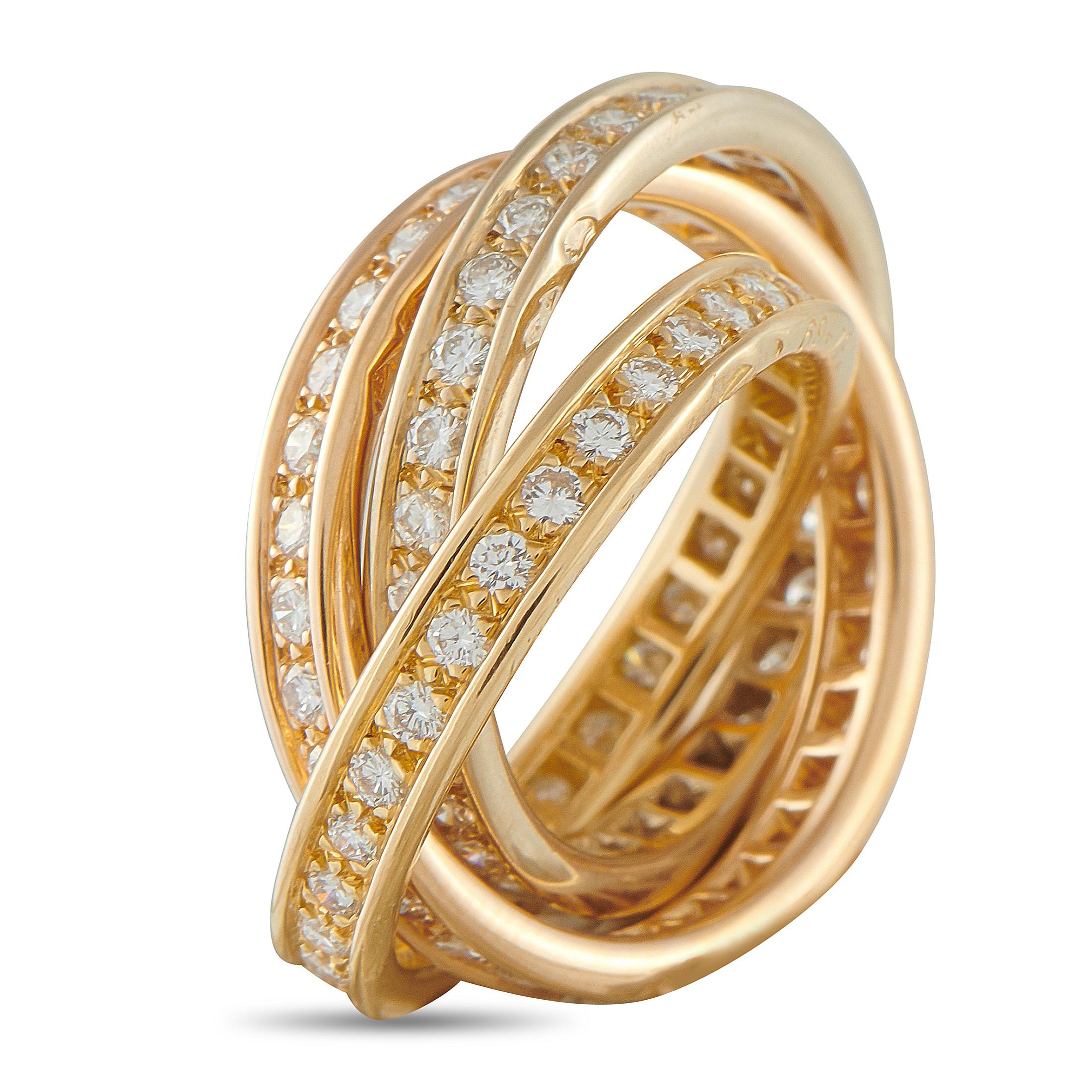In this Cartier Trinity ring, three bands offer endless motion and sparkle. This piece fuses three 18K yellow gold bands into a harmonious, intertwined design. The bands, set with diamonds, glide over one another, delivering a continuous yet
