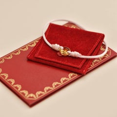 Cartier Trinity 18K Yellow Gold Pink Silk Cord Bracelet