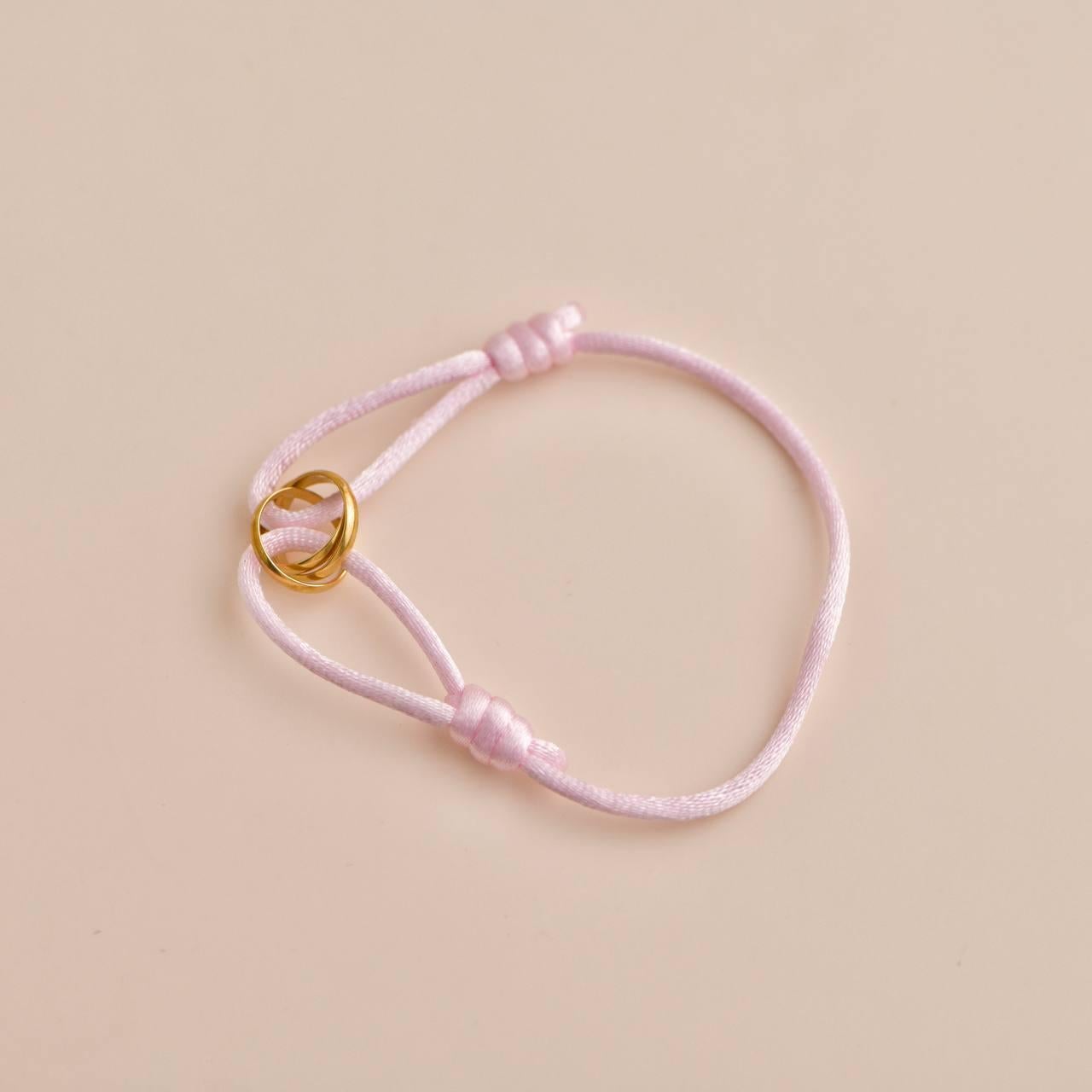 Cartier Trinity 18K Yellow Gold Pink Silk Cord Bracelet In Excellent Condition In Banbury, GB