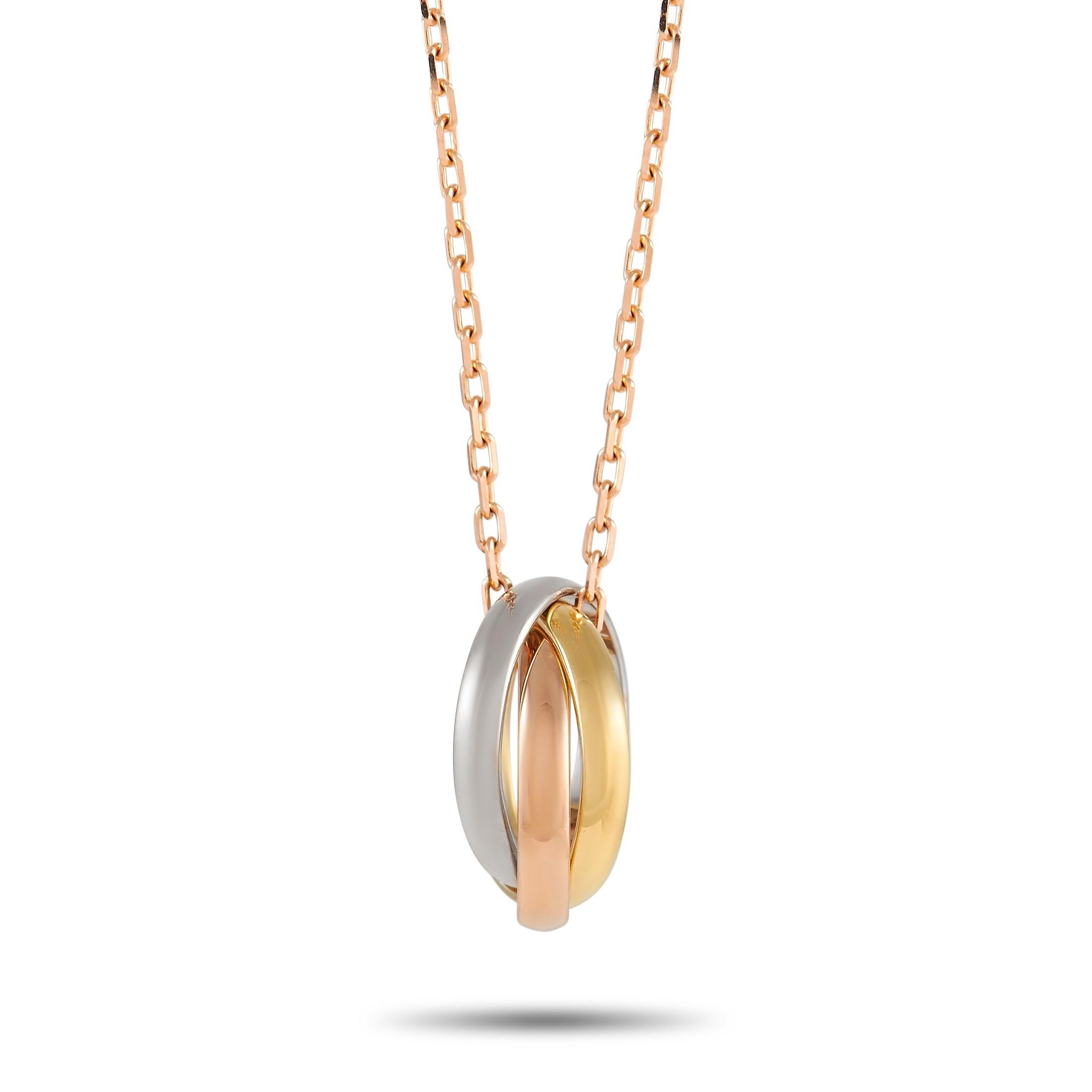 Beautiful and also meaningful, the Cartier 18K Tri-Gold Trinity Ring Necklace makes a timeless statement of love, fidelity, and friendship. It features three interlocking rings fashioned from 18K rose gold, white gold, and yellow gold. The pendant