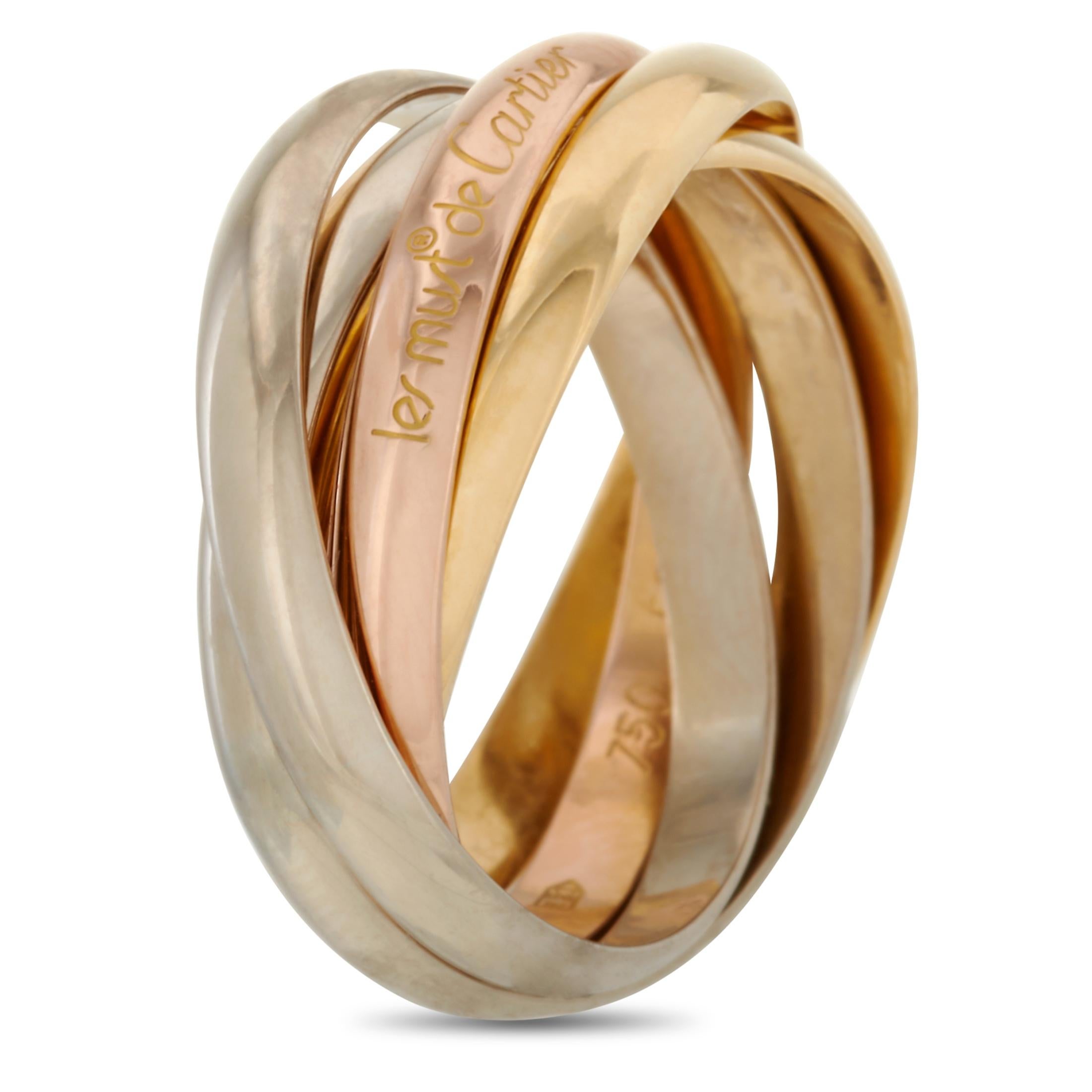 The Cartier “Trinity” ring is made out of 18K yellow, white and rose gold. It weighs 8.9 grams and boasts band thickness of 10 mm.

This item is offered in estate condition and includes the manufacturer’s box and papers.
Ring Size: 6.5