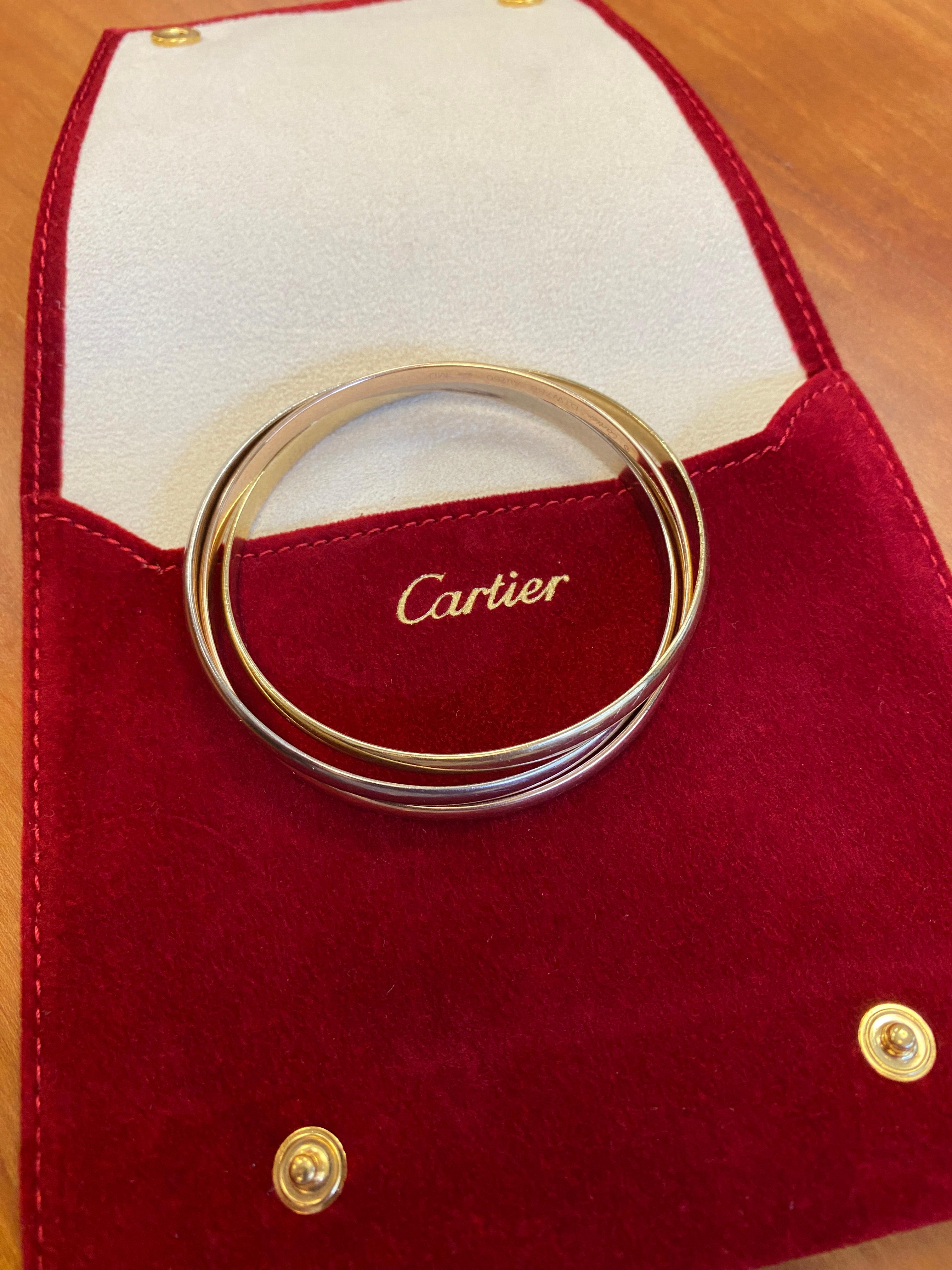 The iconic Cartier Trinity Bracelet is a timeless masterpiece that beautifully combines elegance and symbolism. The Trinity collection was conceived in 1924 and features three intertwined bands, each made from a different color gold, symbolizing