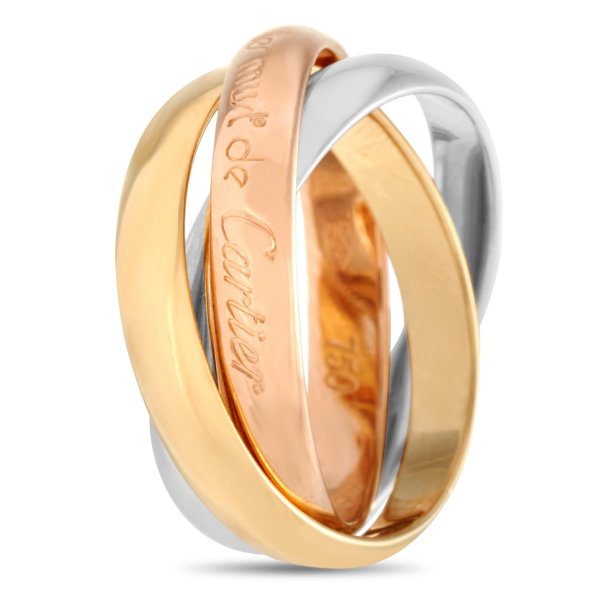 The Cartier “Trinity” ring is made out of 18K yellow, white and rose gold. It weighs 6.7 grams and boasts band thickness of 7 mm.

This item is offered in estate condition and includes a gift box.
Ring Size: 5.0