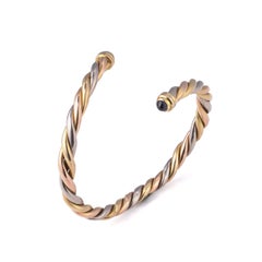Cartier Trinity 18KT Gold Bangle with Cabochon Sapphires, Circa 1970s