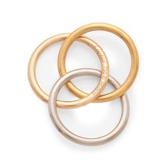 Cartier “Trinity” 3 colour gold pendant with black silk cord