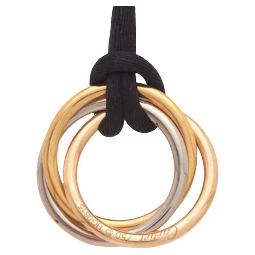 Cartier “Trinity” 3 colour gold pendant with black silk cord  For Sale