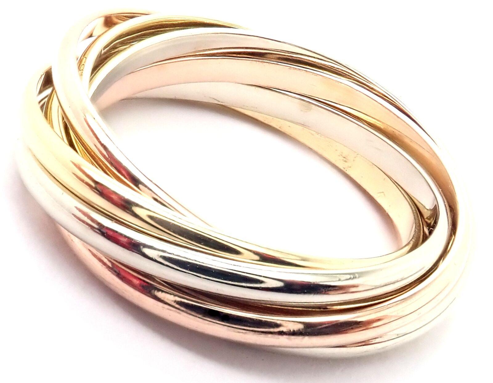18k Tri-Color Gold Trinity 7 Band Ring by Cartier.
This ring comes with Cartier certificate of authenticity.
Details:
Ring Size: European Size 55, US Size 7 1/4
Band Width: 6mm
Weight:  7.5 grams
Stamped Hallmarks: Cartier 750 55 French Hallmarks
