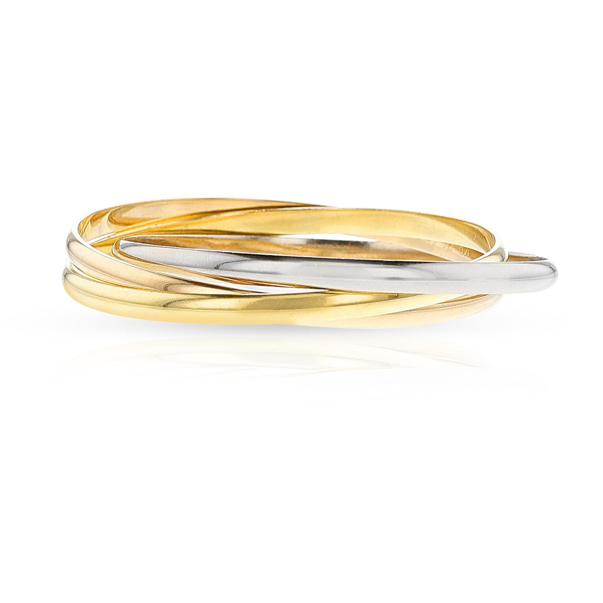 A Cartier Trinity Bangle, 18k Rose, White and Yellow Gold. 68.70 grams. Signed and numbered. 