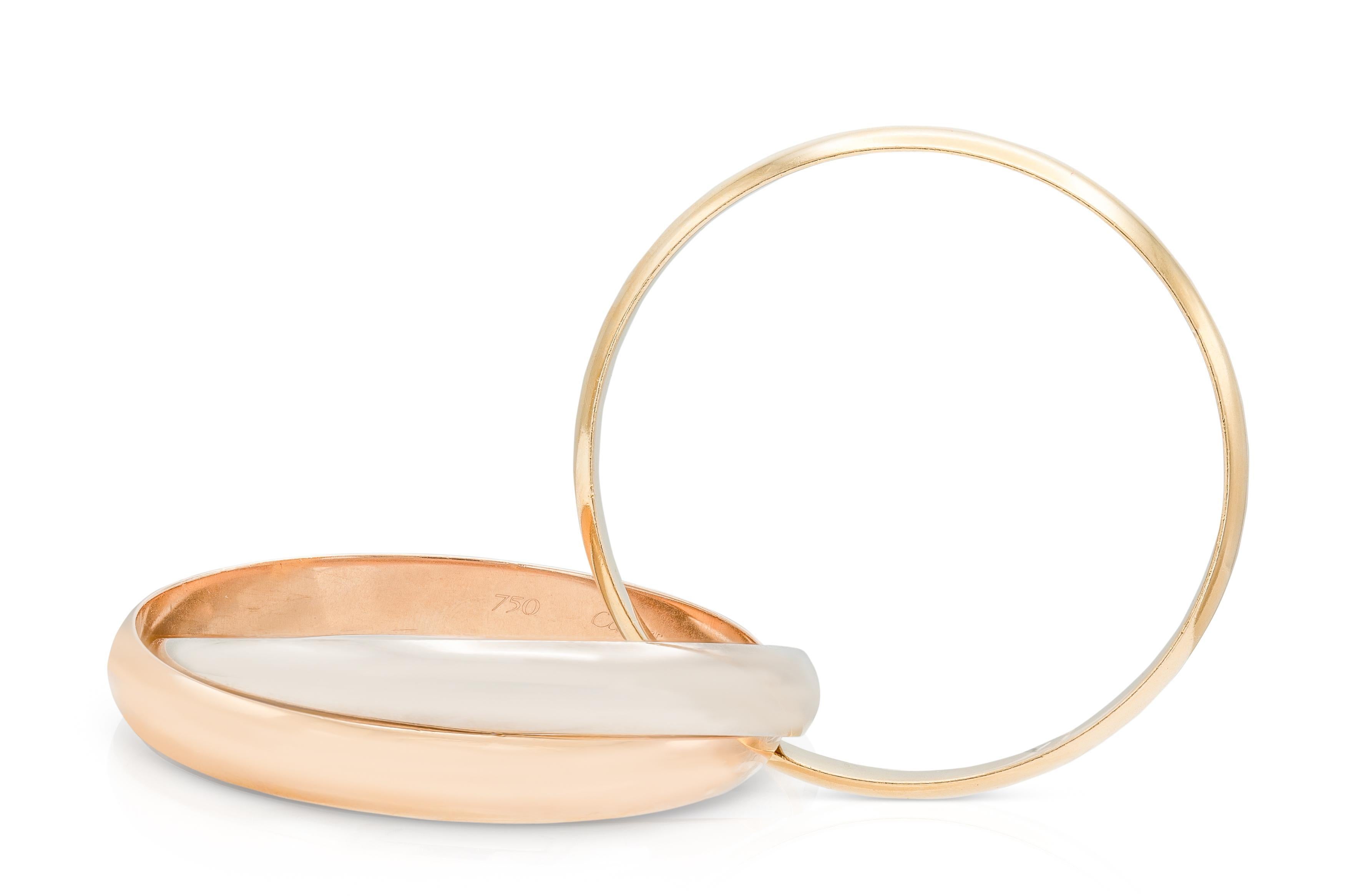 Finamente elaborada en oro amarillo, rosa y blanco de 18 quilates.
Firmado por Cartier, de su colección Trinity.
Modelo extra grande
Tamaño 7 pulgadas
Viene con su Certificado de Autenticidad original y su funda.