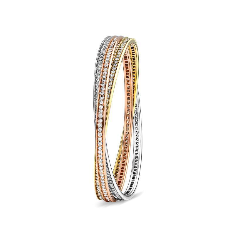 This lovely estate Cartier Trinity bangle bracelet comes in 18k rose, white and yellow gold pave set with diamonds of G color and VVS2 clarity. The diamond weight is approximately 7.08cttw in total.