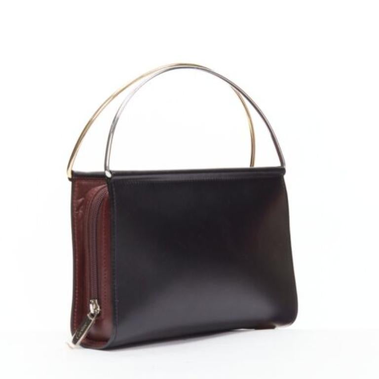CARTIER Trinity black smooth calfskin top metal handle mini bag
Reference: TGAS/D00679
Brand: Cartier
Model: Trinity
Material: Leather
Color: Black, Red
Pattern: Solid
Closure: Zip
Lining: Black Fabric
Extra Details: Burgundy red sides. Zip around