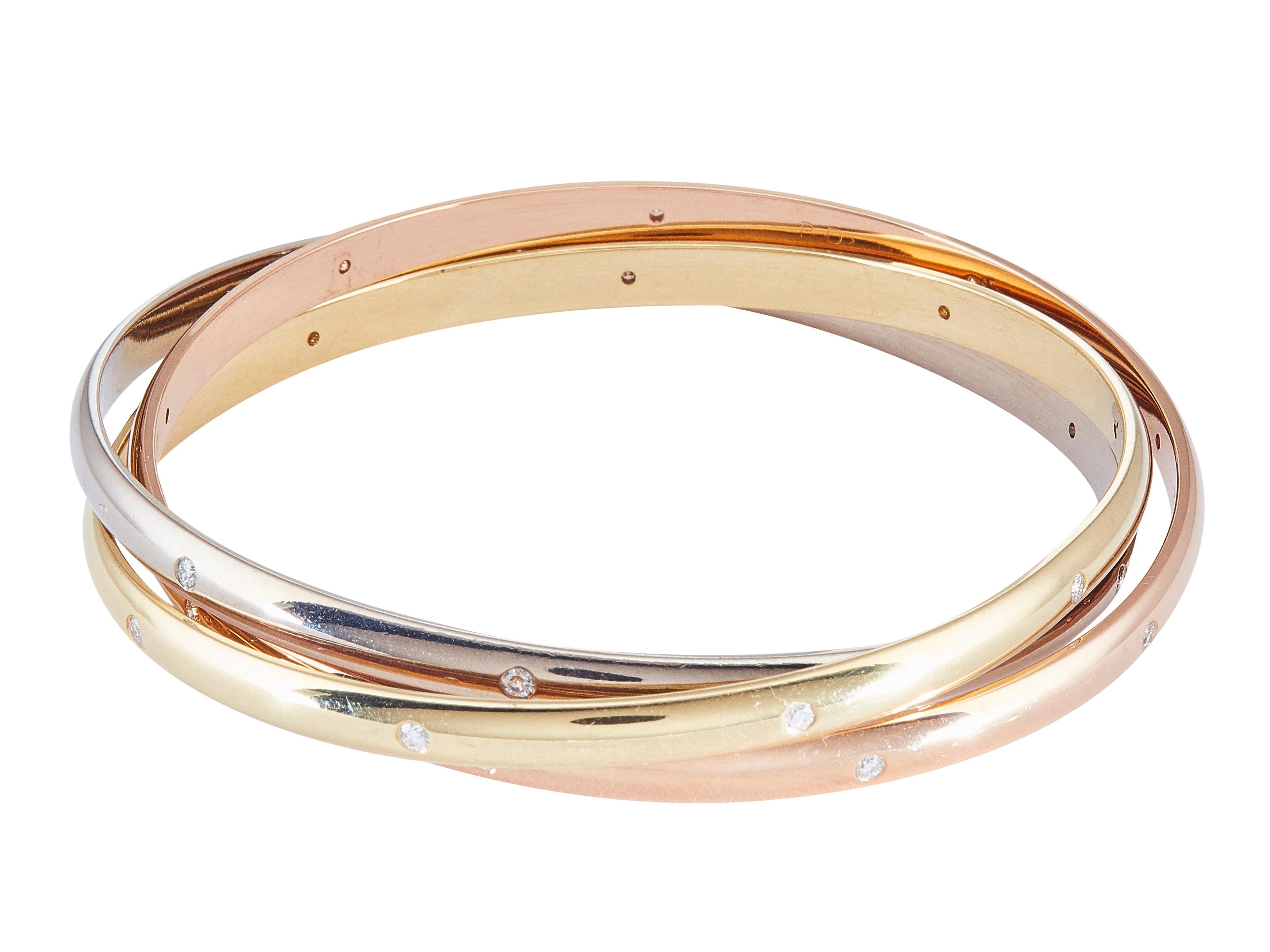 Der Armreif: Ein Cartier Trinity Rolling Armreif aus achtzehn Karat Gelb-, Rosé- und Weißgold.

Begleitet von ...
Sein Cartier-Servicepapier

Das Armband ist in ausgezeichnetem Zustand, mit nur ein paar kleinen Kratzern, die mit normalen Verschleiß