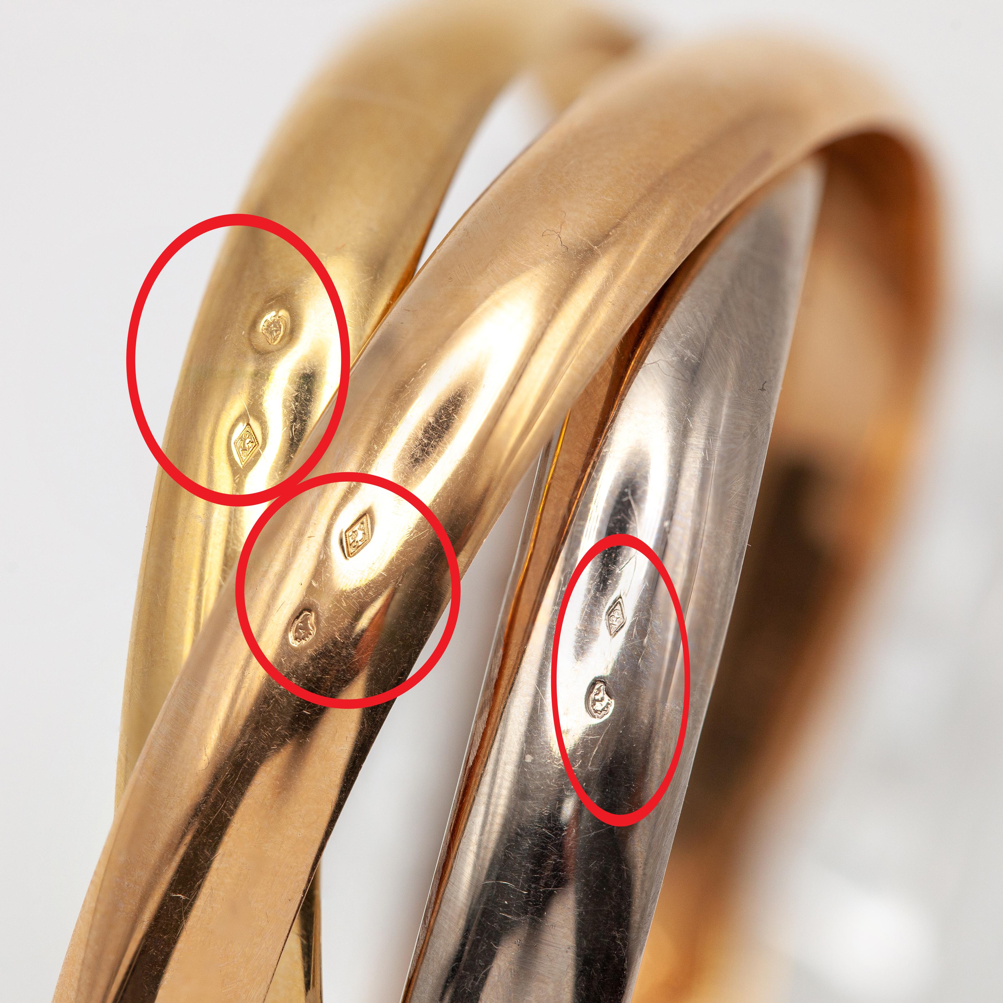 Women's or Men's Cartier Trinity 18 Karat Tri-Color Gold Rolling Bangle Bracelet For Sale